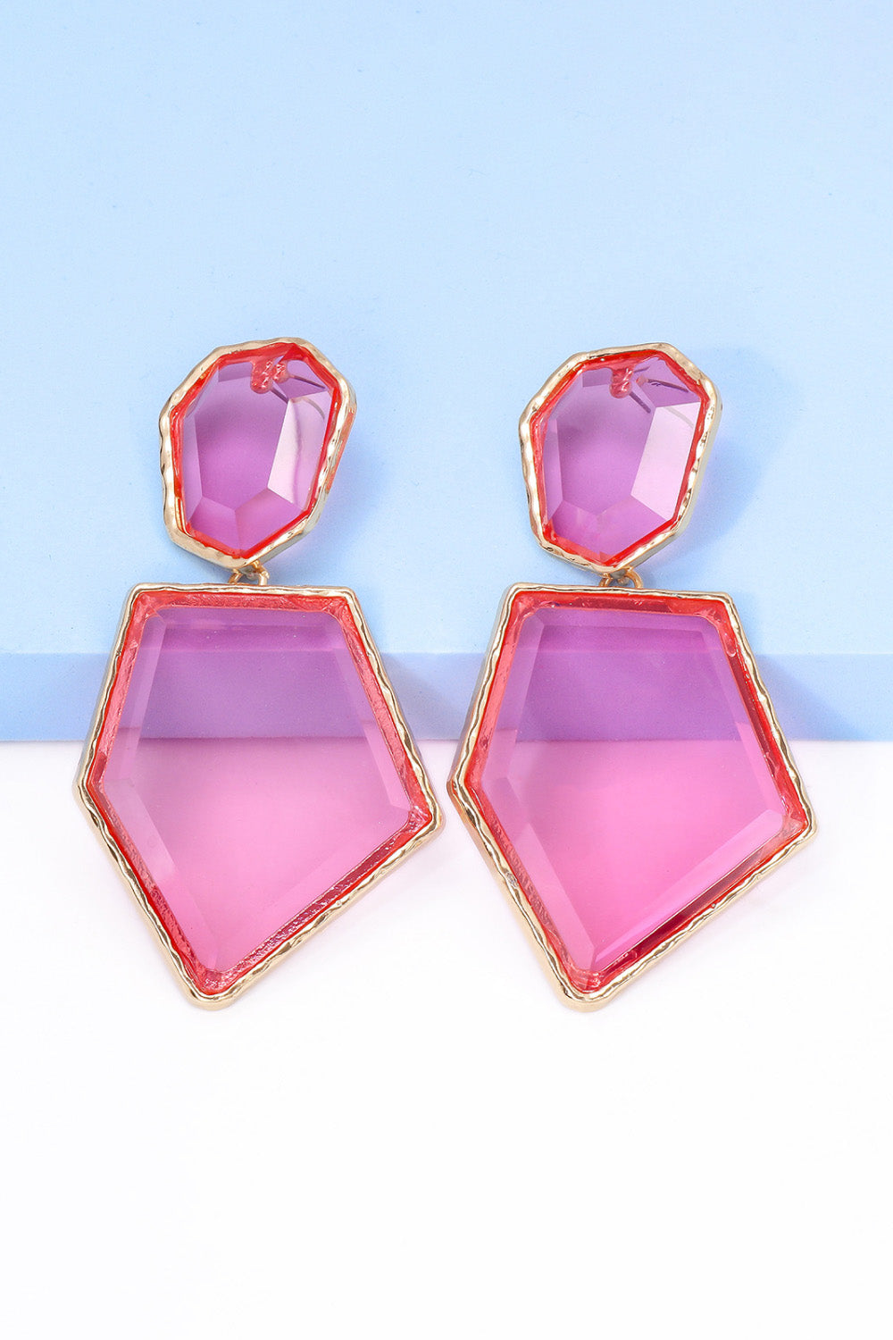 Geometrical shape dangle earrings made of zinc alloy and resin, showcasing a modern design with a unique frame.