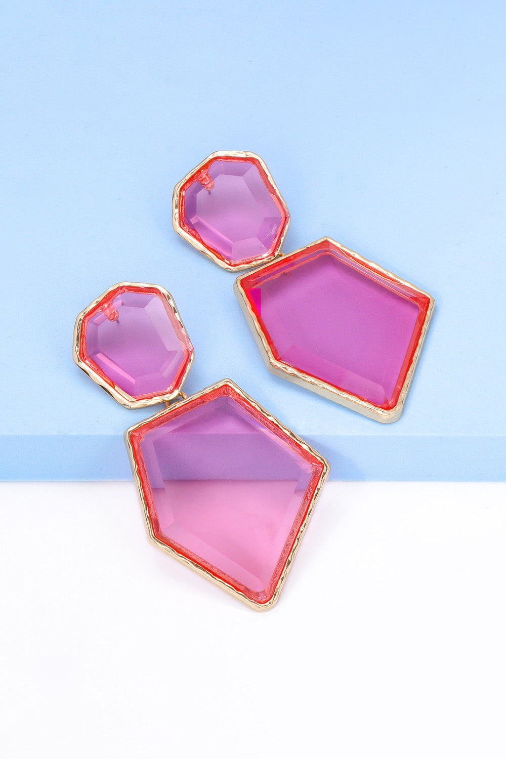 Geometrical shape dangle earrings made of zinc alloy and resin, showcasing a modern design with a unique frame.