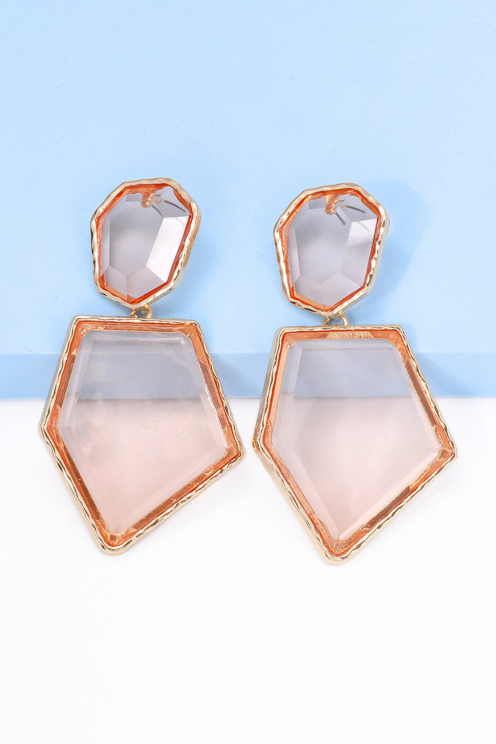 Geometrical shape dangle earrings made of zinc alloy and resin, showcasing a modern design with a unique frame.