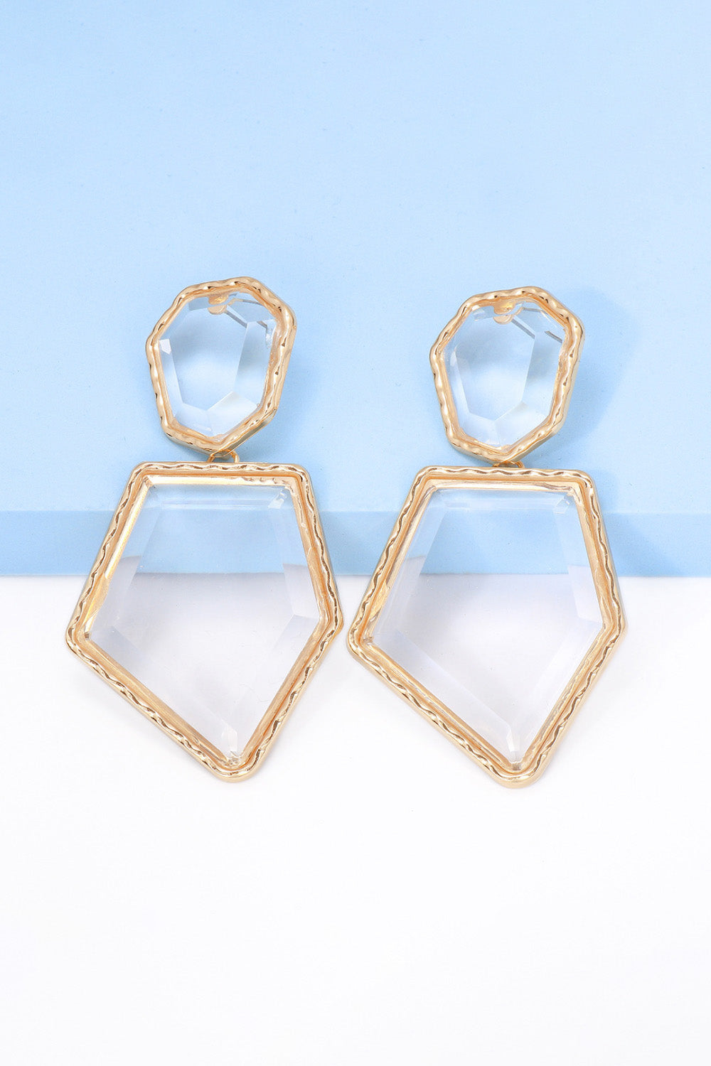 Geometrical shape dangle earrings made of zinc alloy and resin, showcasing a modern design with a unique frame.