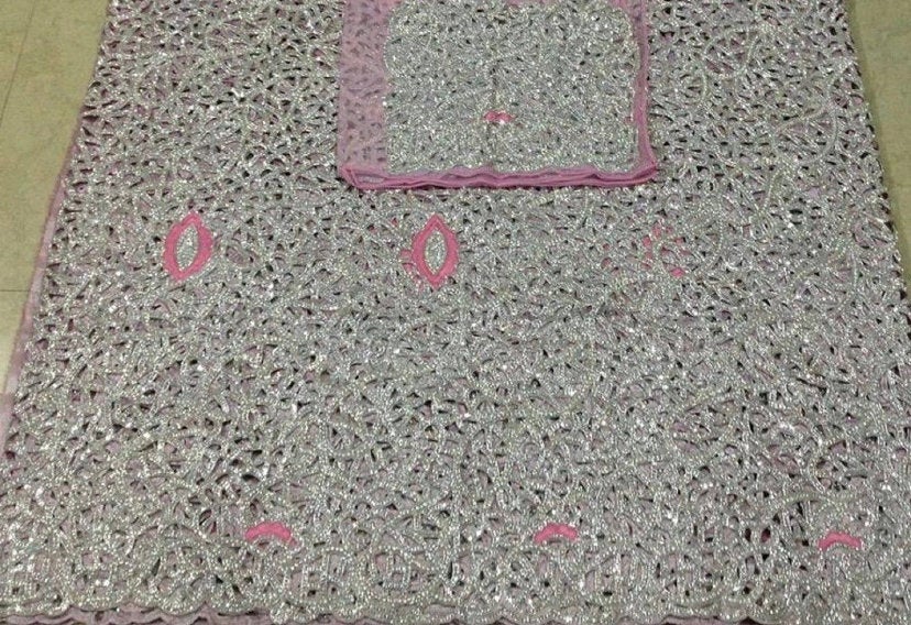 Embroidered lace fabric set.