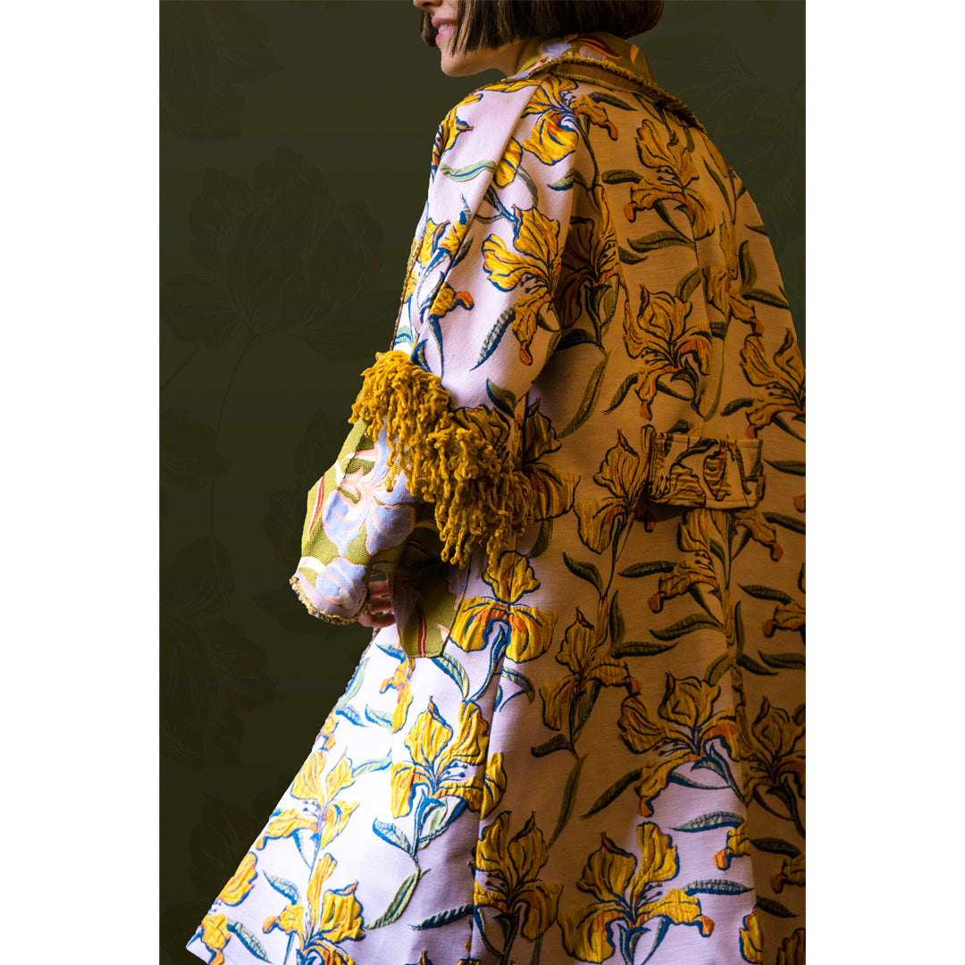 GIGLIO garment featuring a self-embossed floral pattern with fringed arms and a turned-out collar, showcasing elegance and comfort.