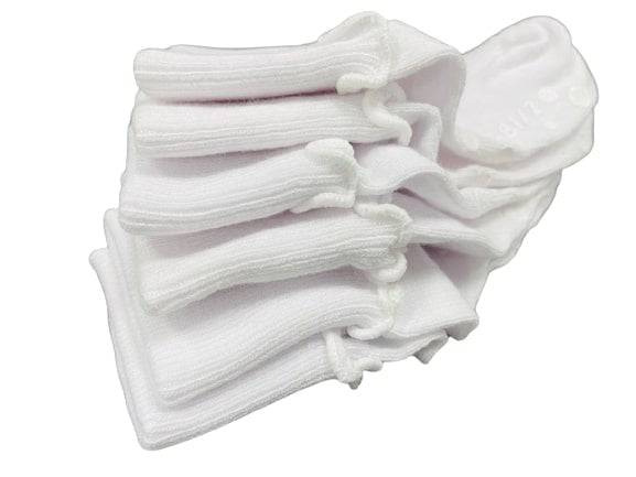 Girls Non-Skid Seamless Toe Socks in white with pink and white ruffle edges, showcasing a soft cotton material and non-skid dots on the bottom.