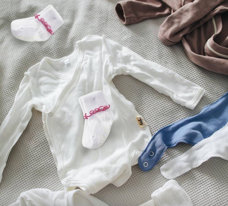 Girls Non-Skid Seamless Toe Socks in white with pink and white ruffle edges, showcasing a soft cotton material and non-skid dots on the bottom.