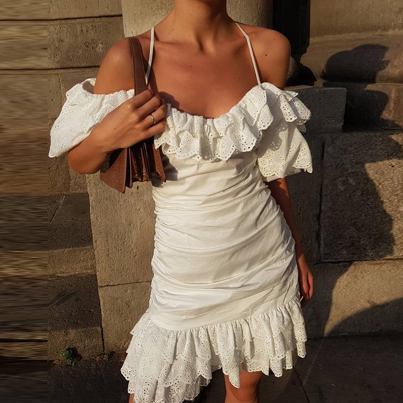 Glamaker Ruffles hollow out white dress featuring an elegant off-shoulder design with cascading ruffles and a mini length.