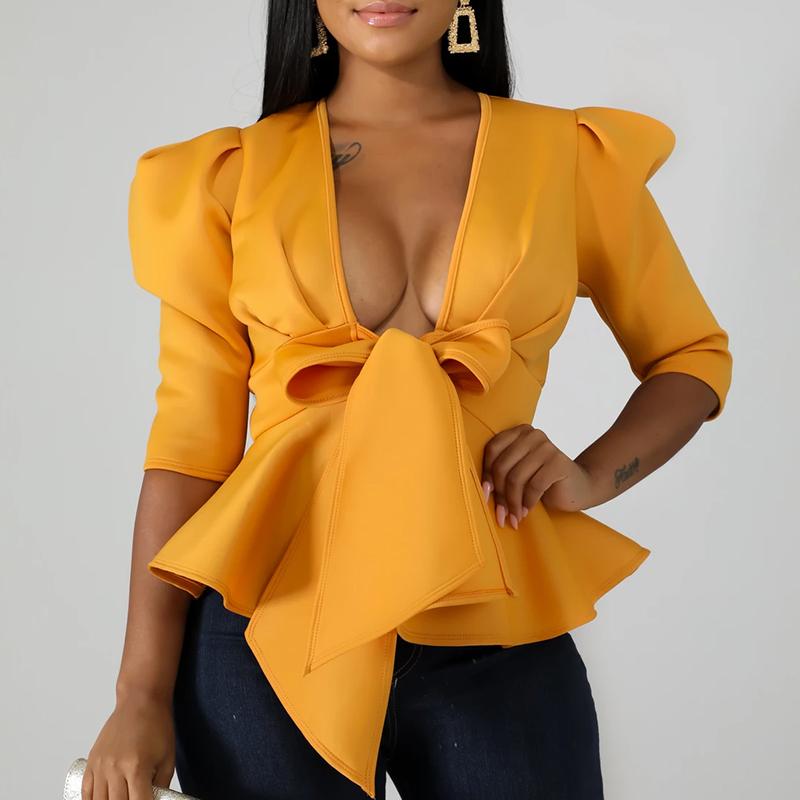 Glamaker Ruffles V Neck Blouse with puff sleeves and tie bow, showcasing elegant design and stylish silhouette.