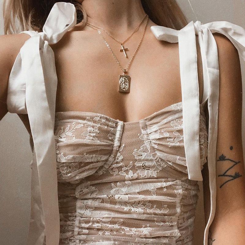 Glamaker white flower print v neck short blouse for women, featuring a floral design and sleeveless style.