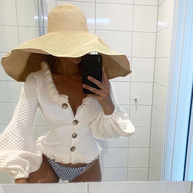 Glamaker White long lantern sleeve ruffles blouse featuring an elegant v-neck design, perfect for stylish women.