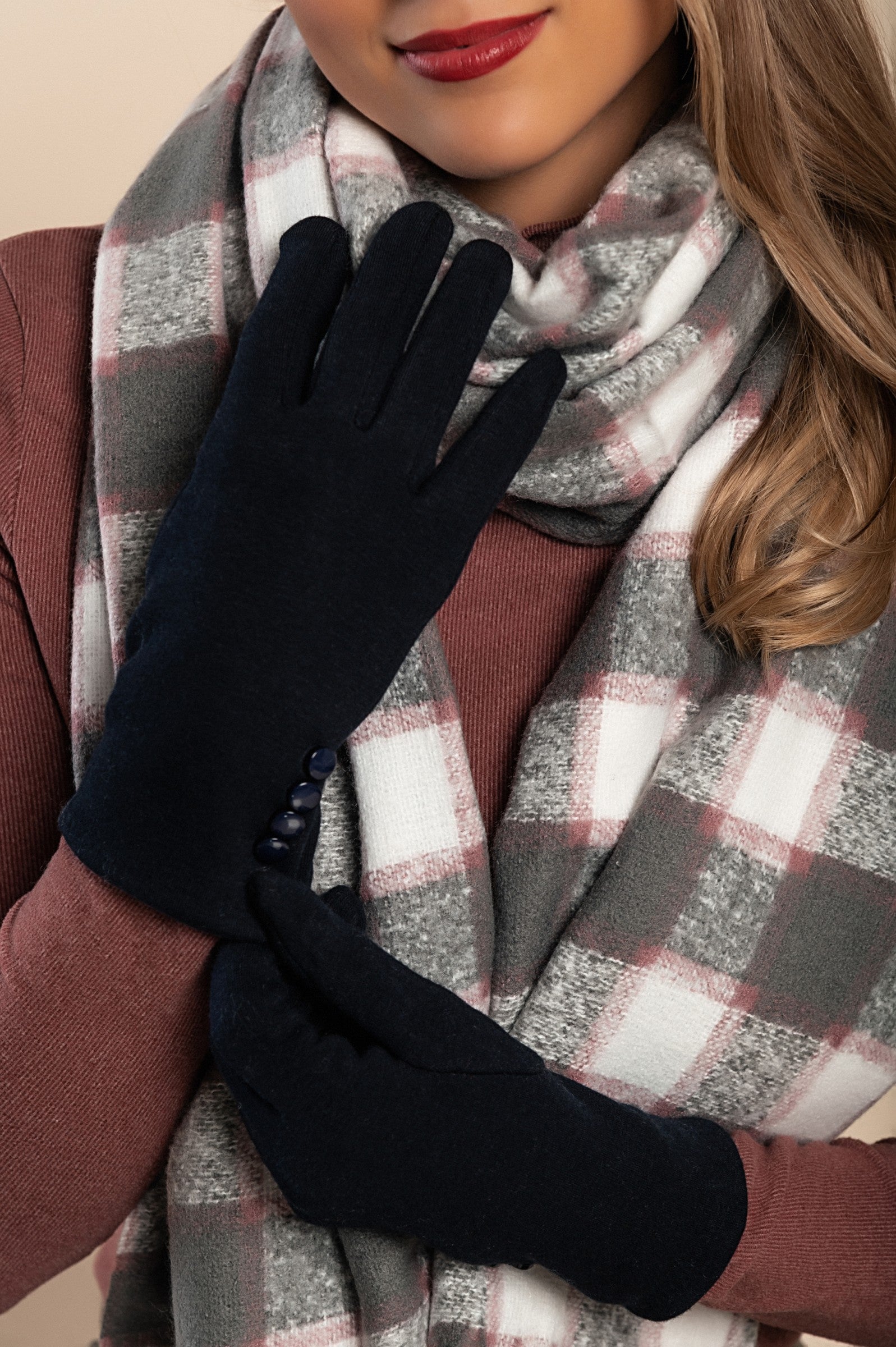 Stylish blue gloves with decorative buttons, showcasing a soft fabric and padded design for warmth.