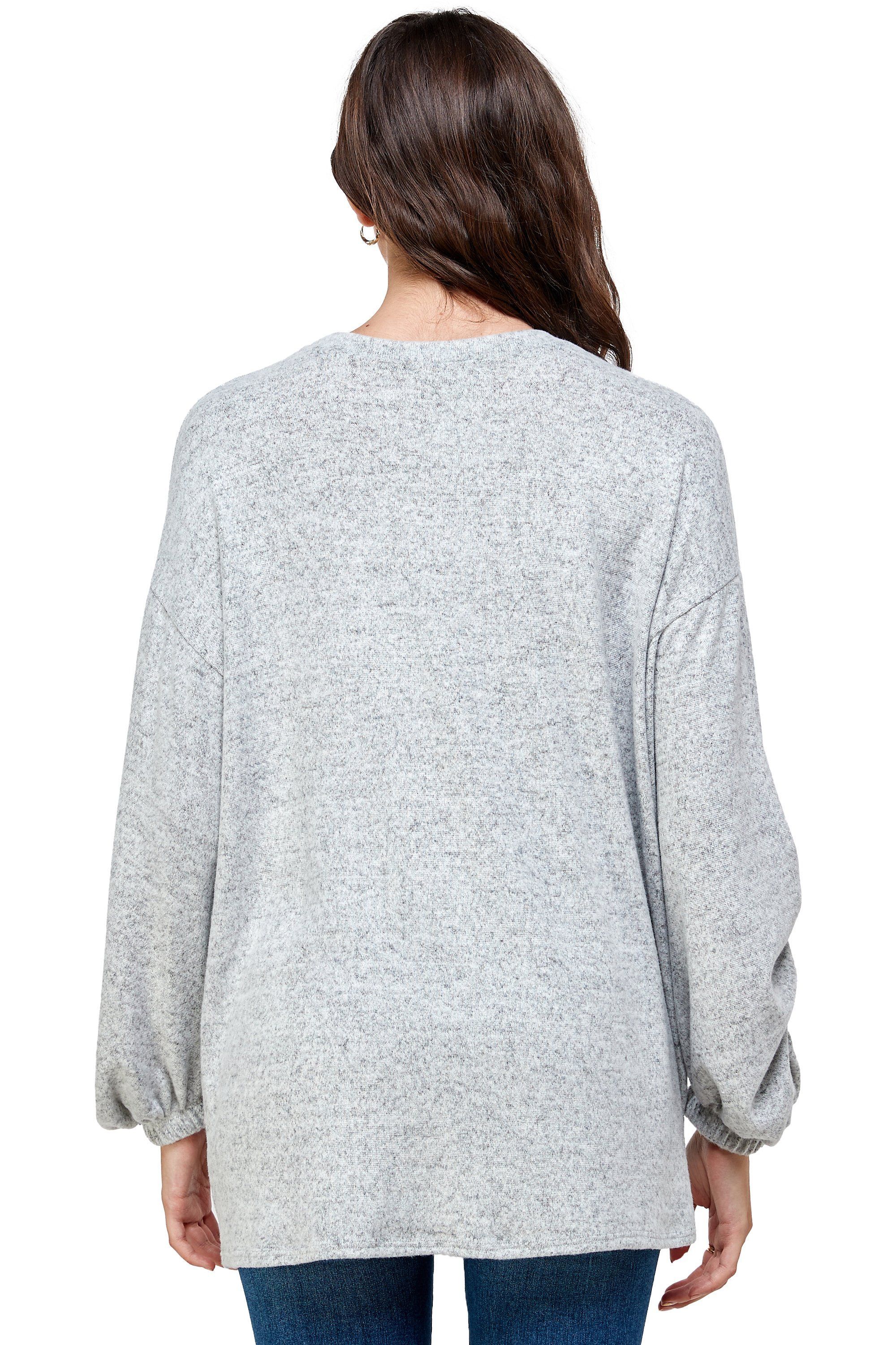 Brushed knit loose fit sweatshirt with trendy screen print design, modeled by a woman standing at 5'-8" wearing size Small.