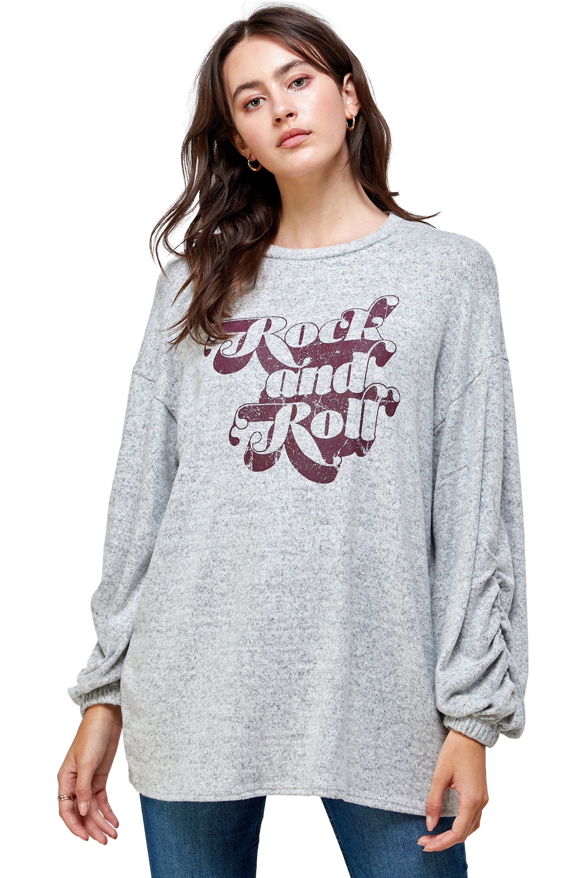 Brushed knit loose fit sweatshirt with trendy screen print design, modeled by a woman standing at 5'-8" wearing size Small.