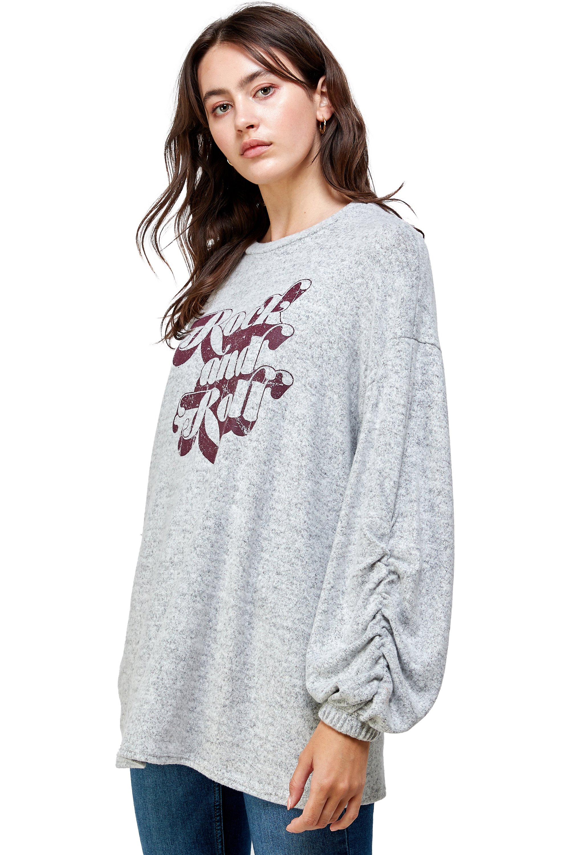 Brushed knit loose fit sweatshirt with trendy screen print design, modeled by a woman standing at 5'-8" wearing size Small.