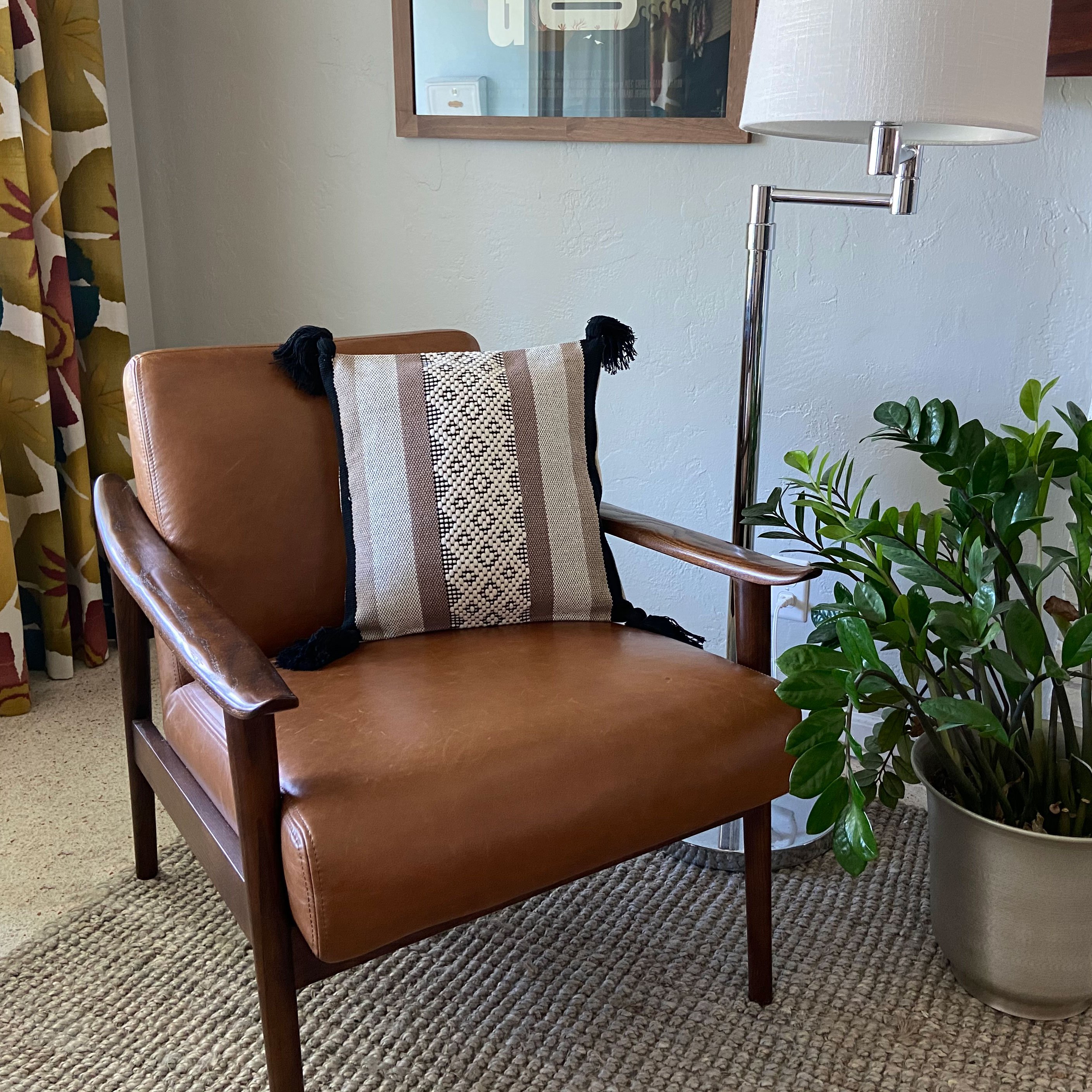 Greca Accent Pillow Cover with colorful geometric design and four tassels, handmade in Oaxaca, Mexico.
