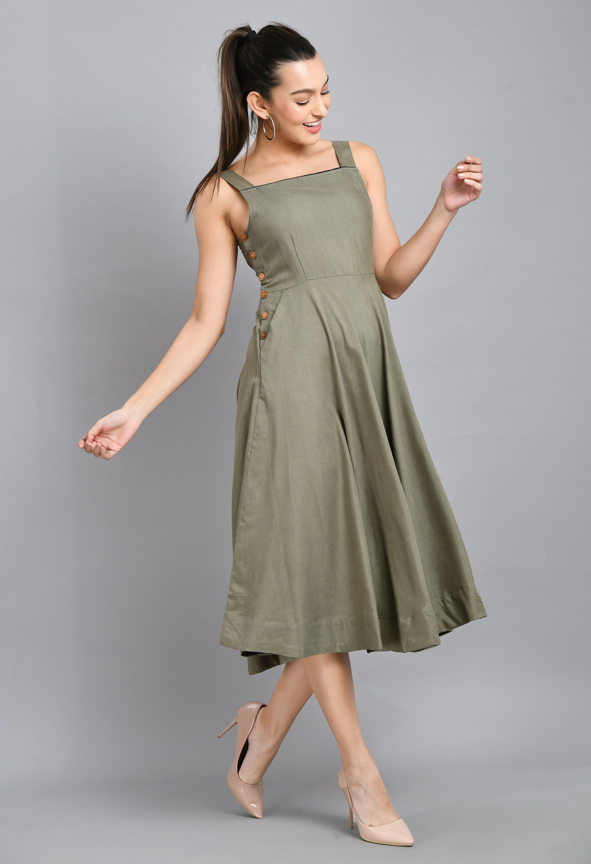 A stylish grey linen dress featuring wood buttons, sleeveless design, and an asymmetrical hem, perfect for casual occasions.