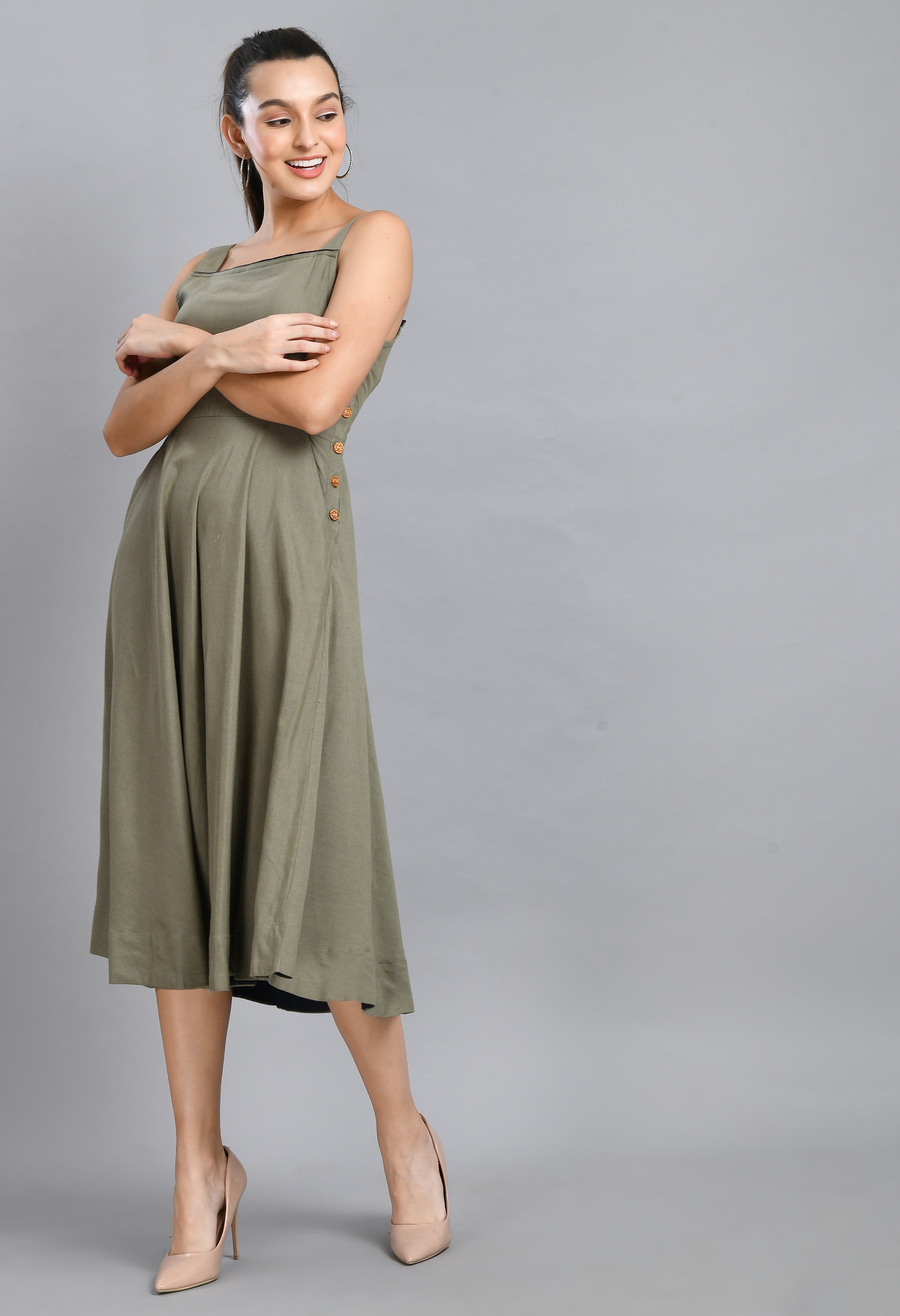 A stylish grey linen dress featuring wood buttons, sleeveless design, and an asymmetrical hem, perfect for casual occasions.