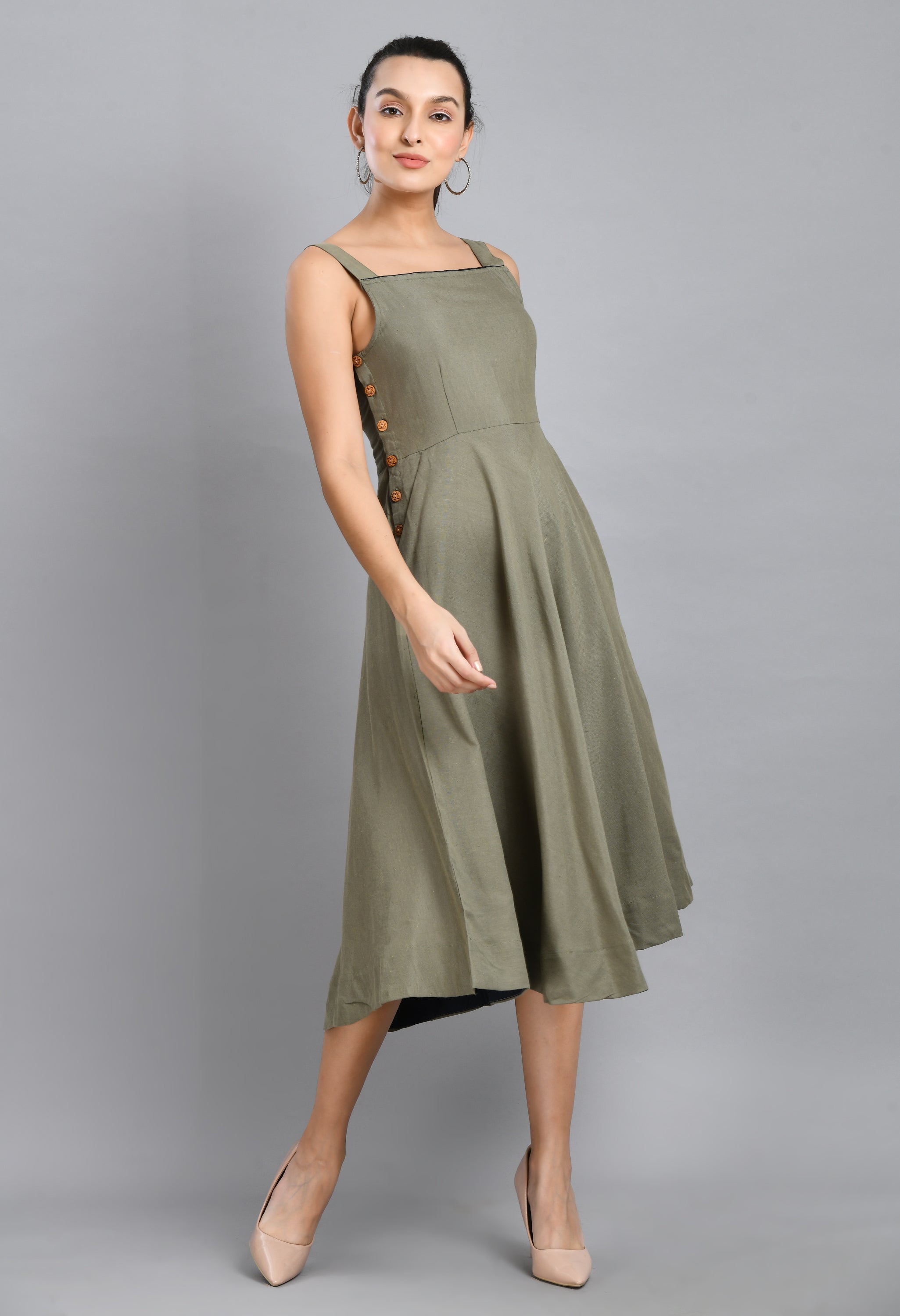 A stylish grey linen dress featuring wood buttons, sleeveless design, and an asymmetrical hem, perfect for casual occasions.
