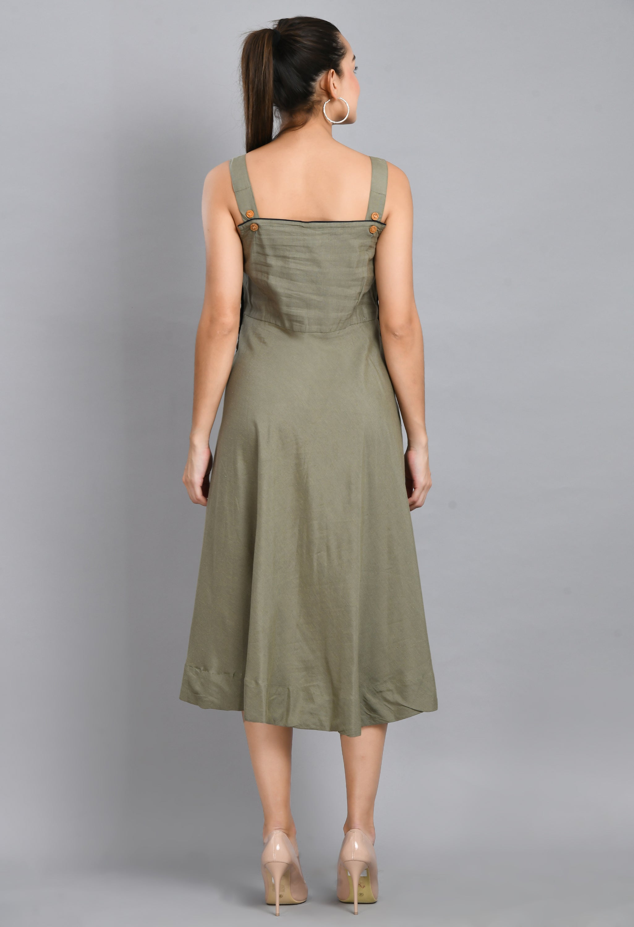 A stylish grey linen dress featuring wood buttons, sleeveless design, and an asymmetrical hem, perfect for casual occasions.