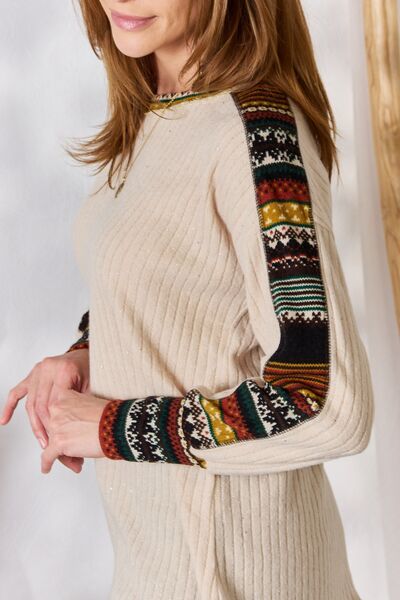 Hailey & Co Exposed Seam Long Sleeve Ribbed Knit Top in festive design, showcasing its ribbed texture and exposed seam details.