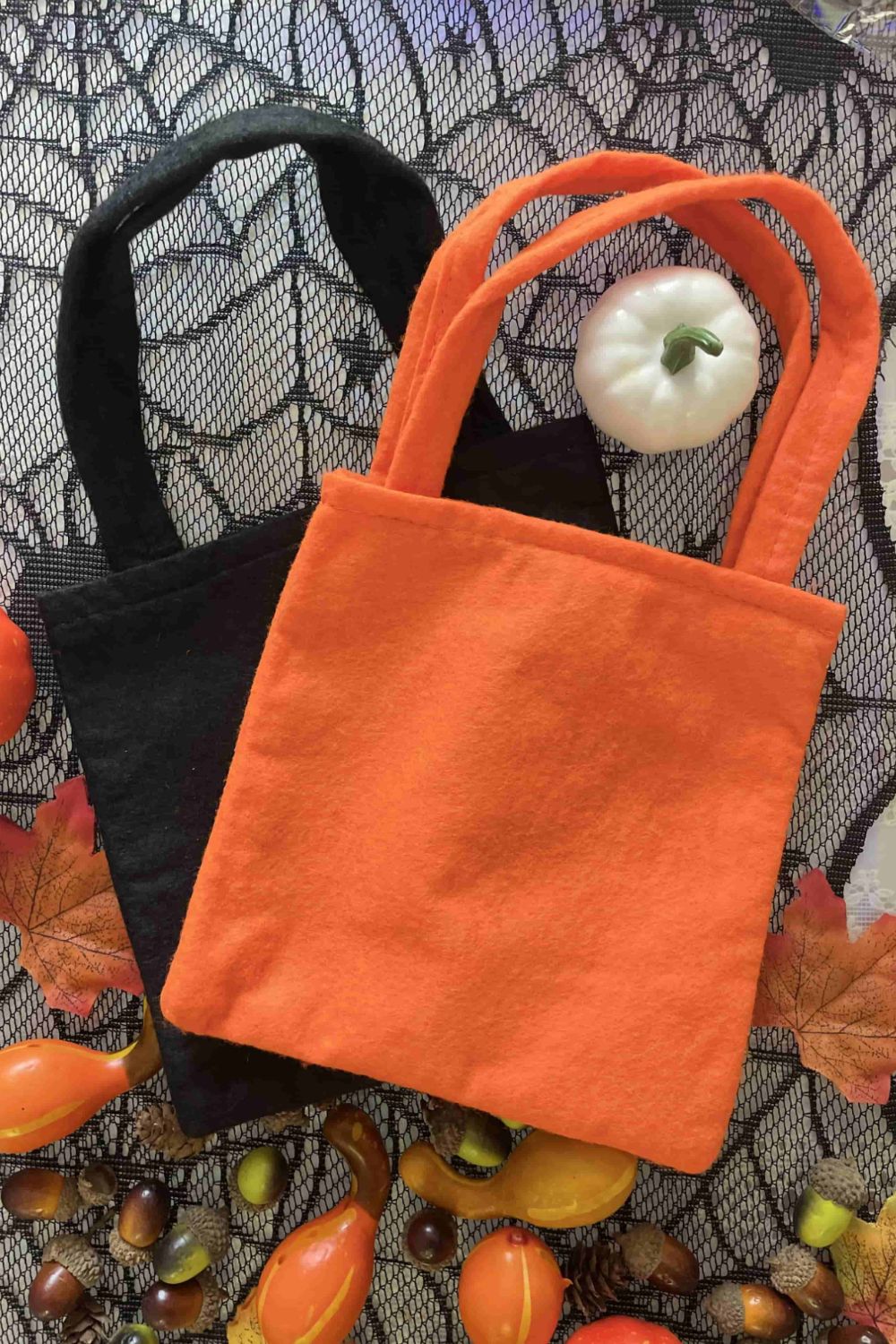 Two Halloween-themed graphic tote bags with vibrant designs, perfect for trick-or-treating.