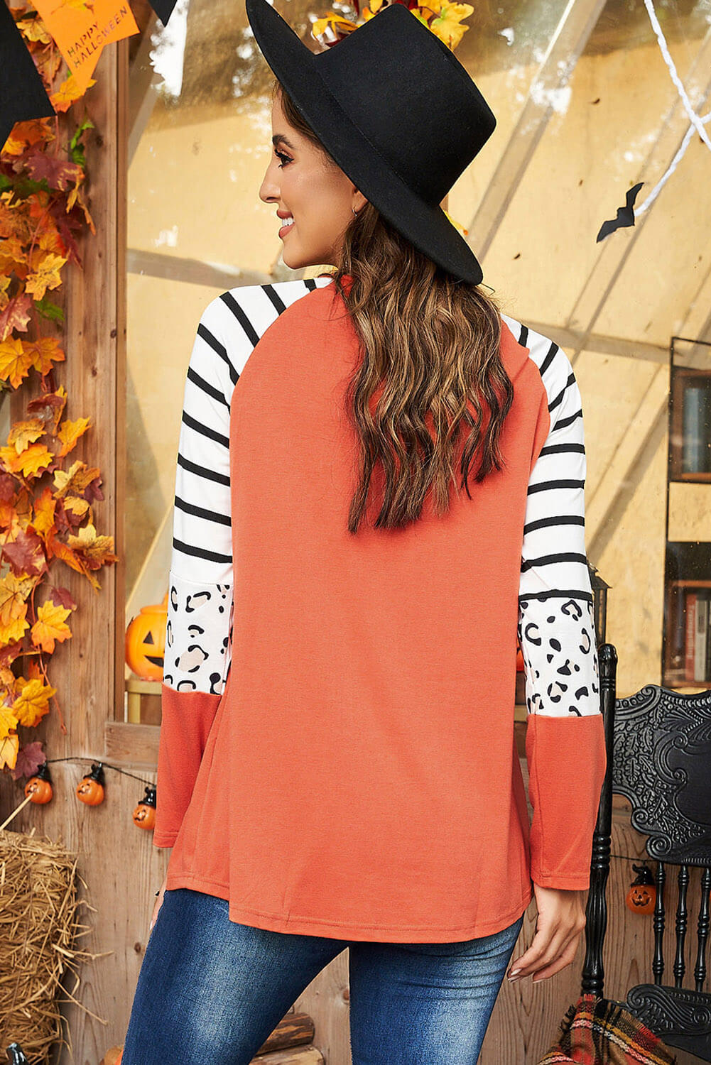 Halloween Graphic Mixed Print Raglan Sleeve Top featuring a mix of graphic, striped, and leopard prints with long sleeves.