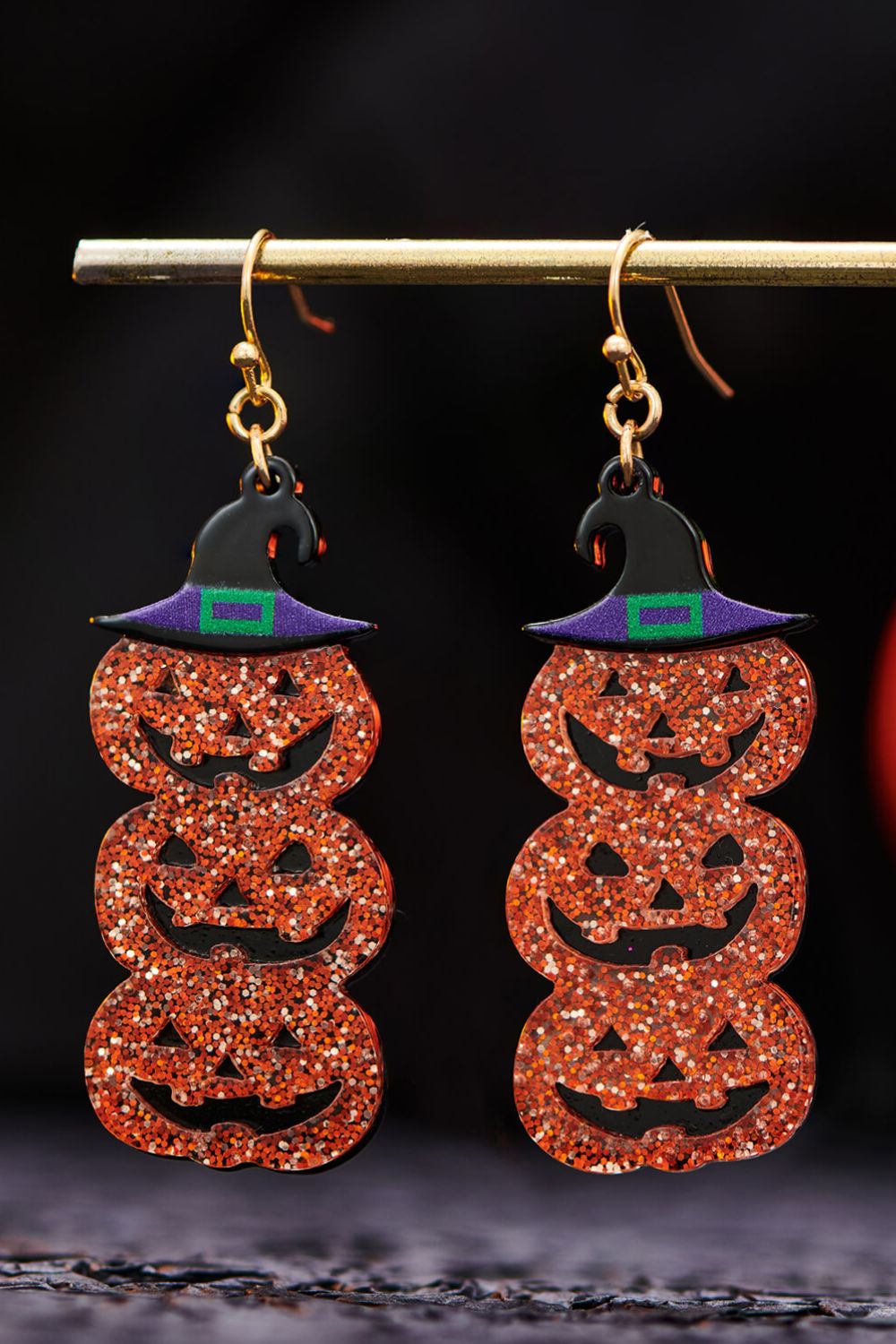 A pair of Halloween Jack-O-Lantern dangle earrings featuring a vibrant pumpkin design, perfect for festive celebrations.
