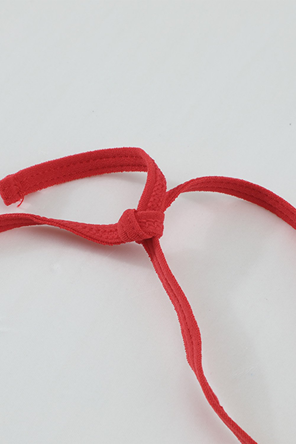 Halter Neck Backless Strappy Lace Teddy in red, showcasing intricate lace design and strappy details, perfect for intimate occasions.