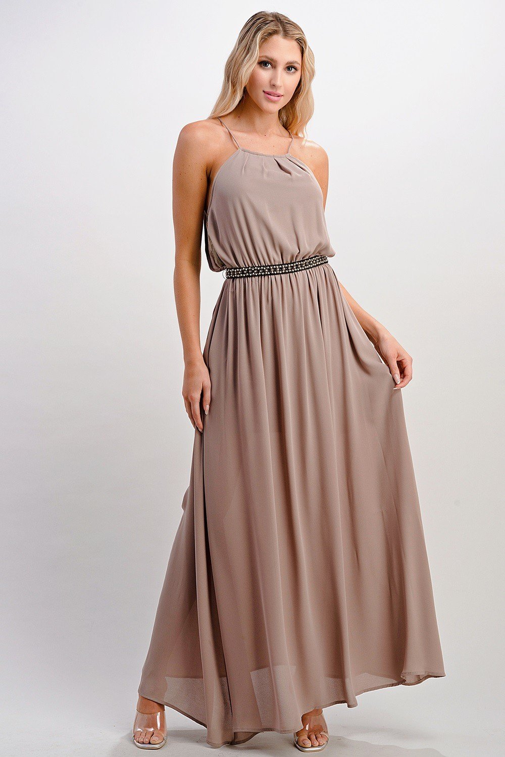 A beautiful model wearing a Pleated Cami Chiffon Maxi Dress, showcasing its elegant pleats and flowing design.