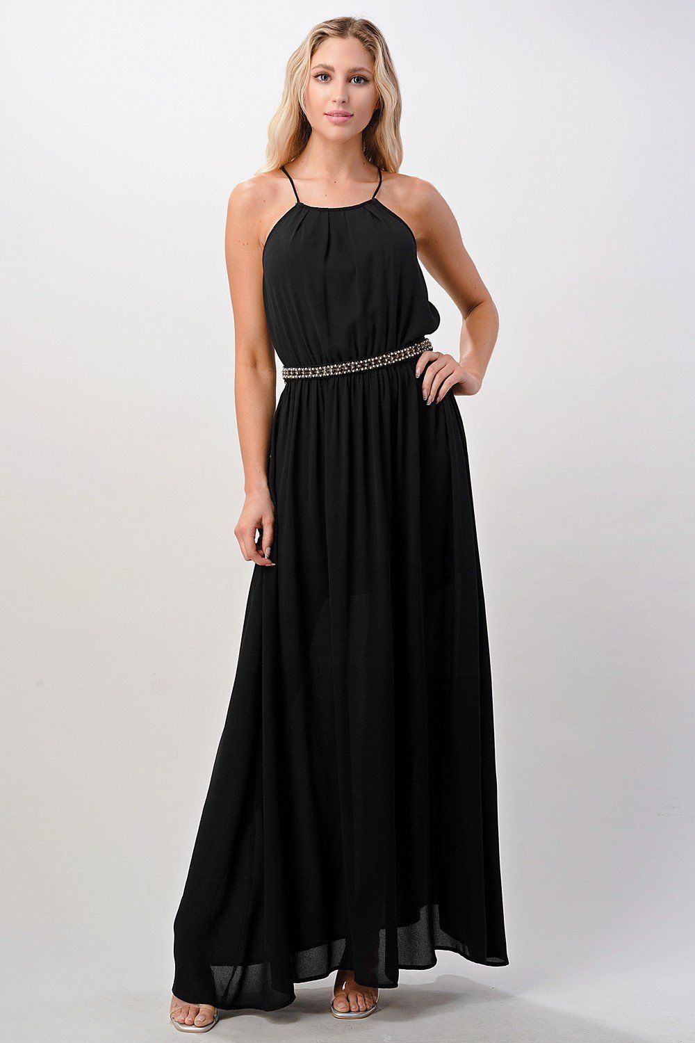 A beautiful model wearing a Pleated Cami Chiffon Maxi Dress, showcasing its elegant pleats and flowing design.