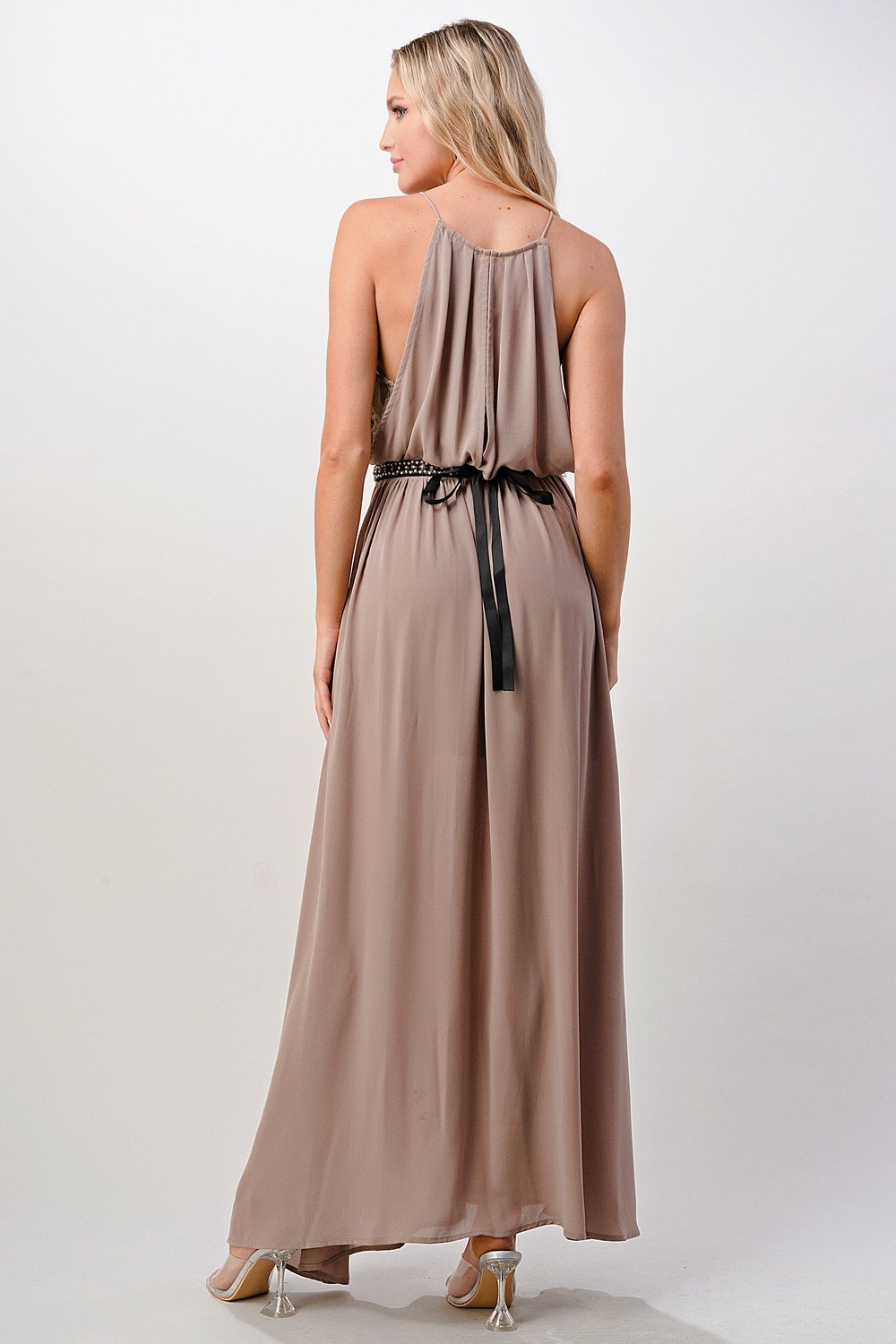 A beautiful model wearing a Pleated Cami Chiffon Maxi Dress, showcasing its elegant pleats and flowing design.
