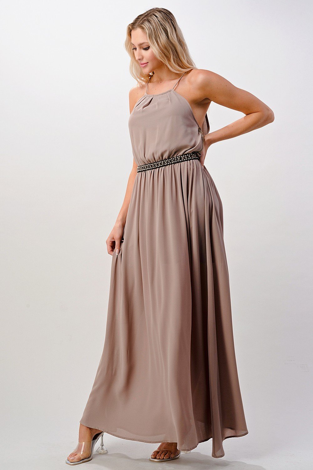A beautiful model wearing a Pleated Cami Chiffon Maxi Dress, showcasing its elegant pleats and flowing design.