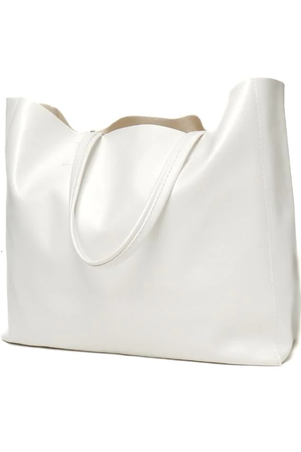 Elegant white handbag made of high-quality faux leather, featuring a chic design and spacious interior.