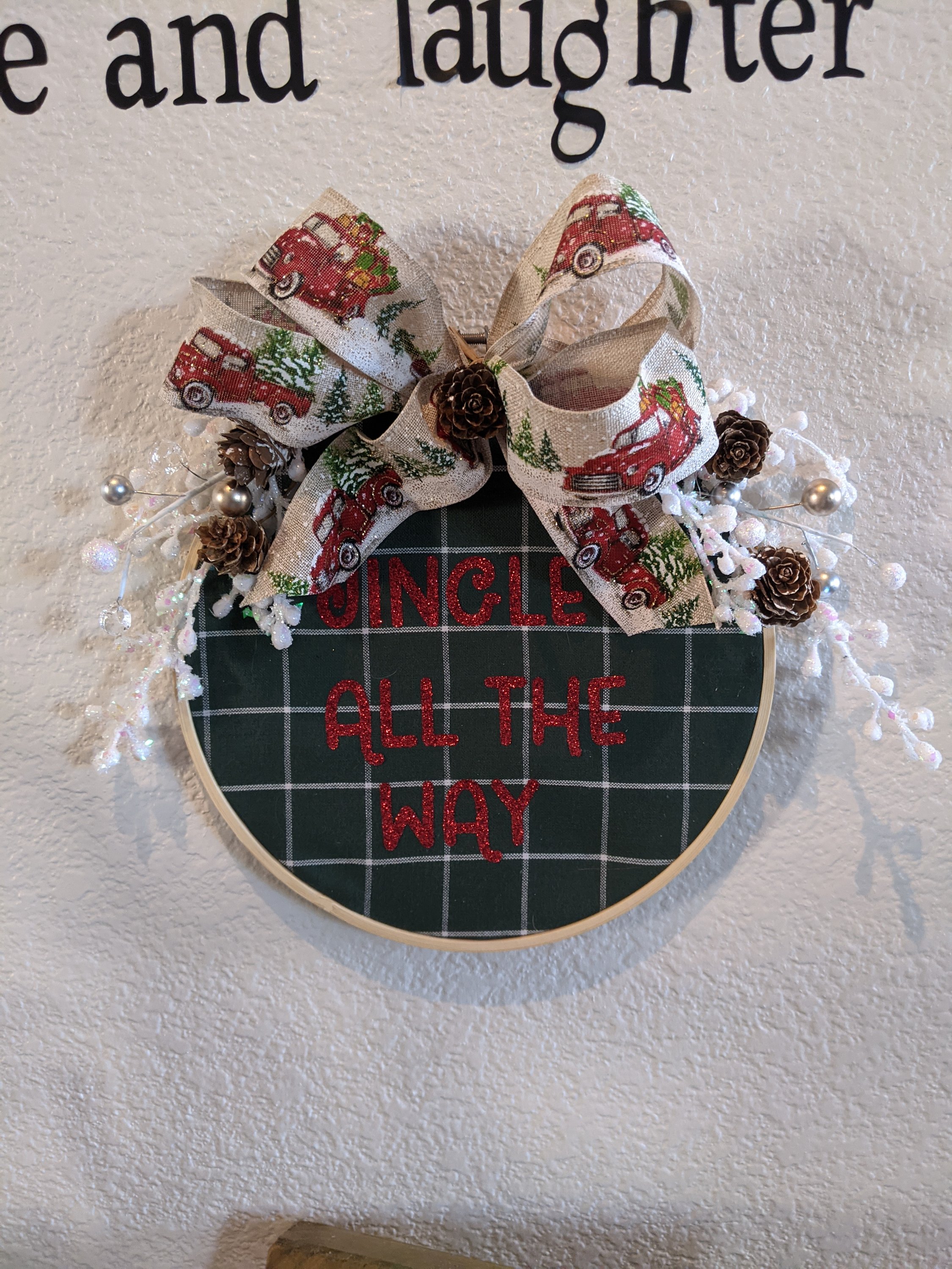 A collection of handmade holiday hoops in various sizes, showcasing intricate designs and festive colors, perfect for seasonal decor.