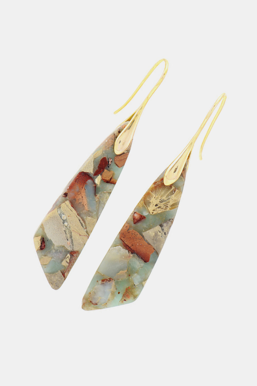 A pair of handmade dangle earrings featuring natural stones, copper, and gold plating, showcasing unique patterns and modern design.