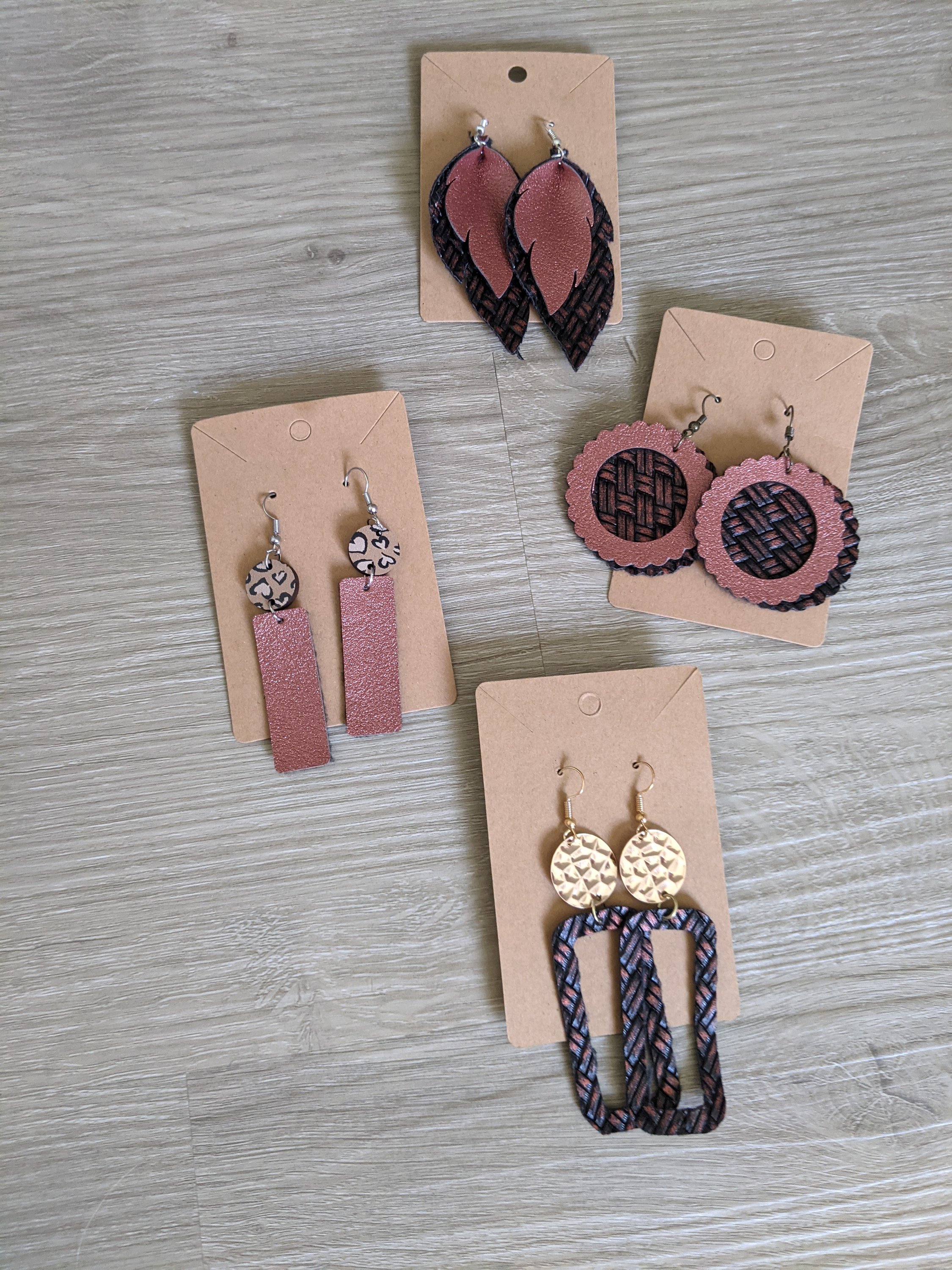Handmade shimmer burgundy metallic basket weave faux leather earrings, showcasing intricate design and lightweight texture.