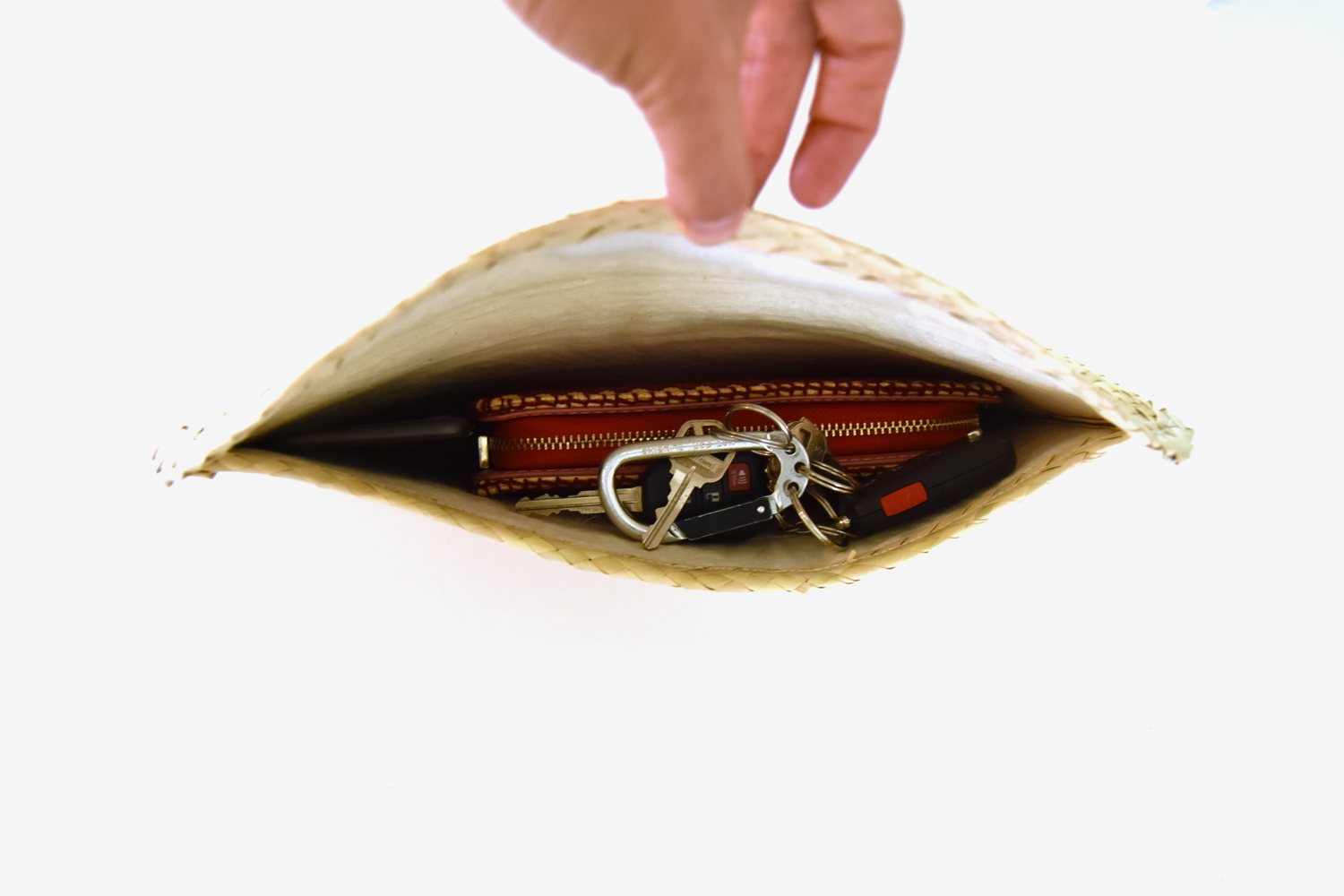 Handmade small bag featuring colorful sequin triangles and purple trim, crafted from natural palm leaves.