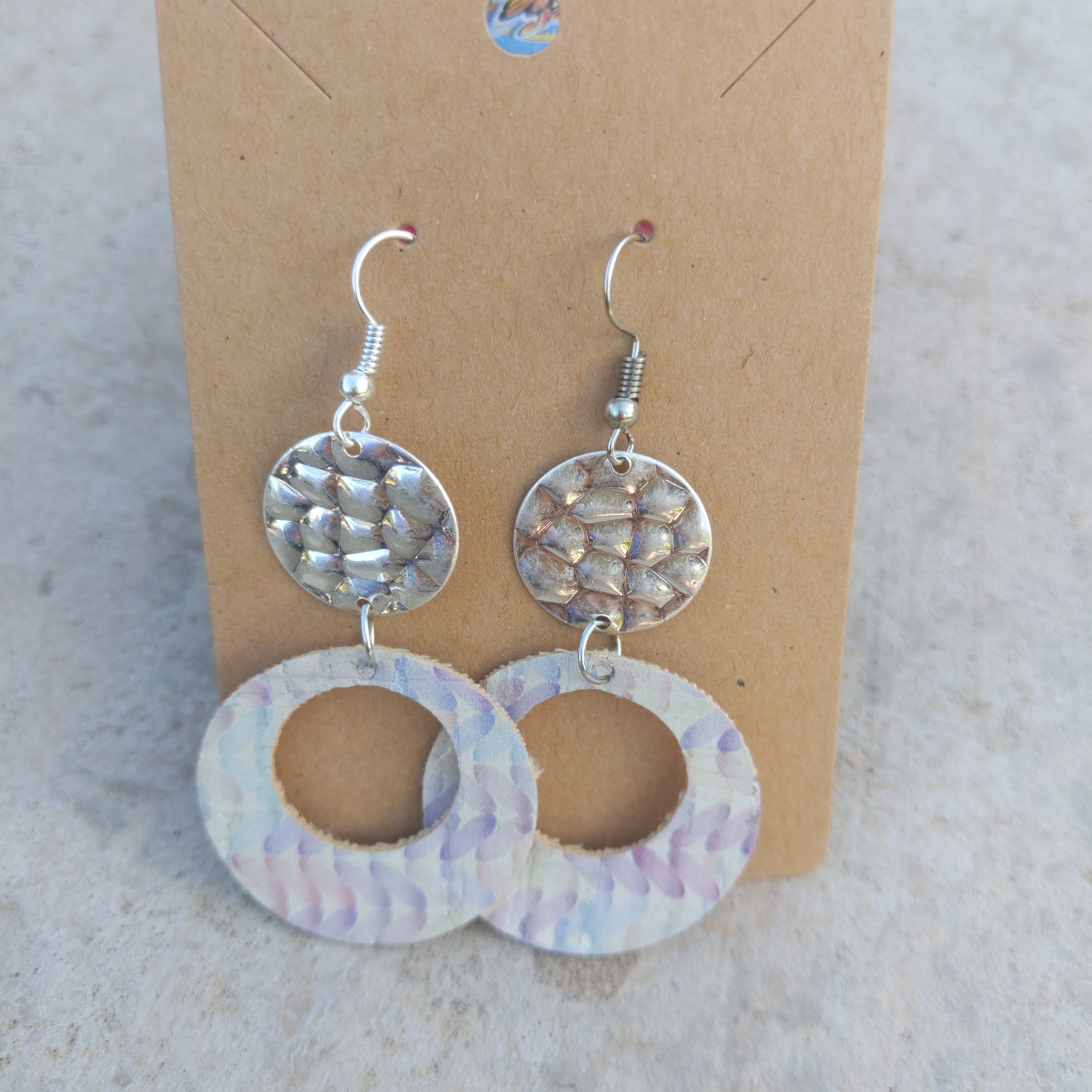 Handmade watercolor dangle earrings featuring a silver disk detail, showcasing vibrant colors and lightweight design.