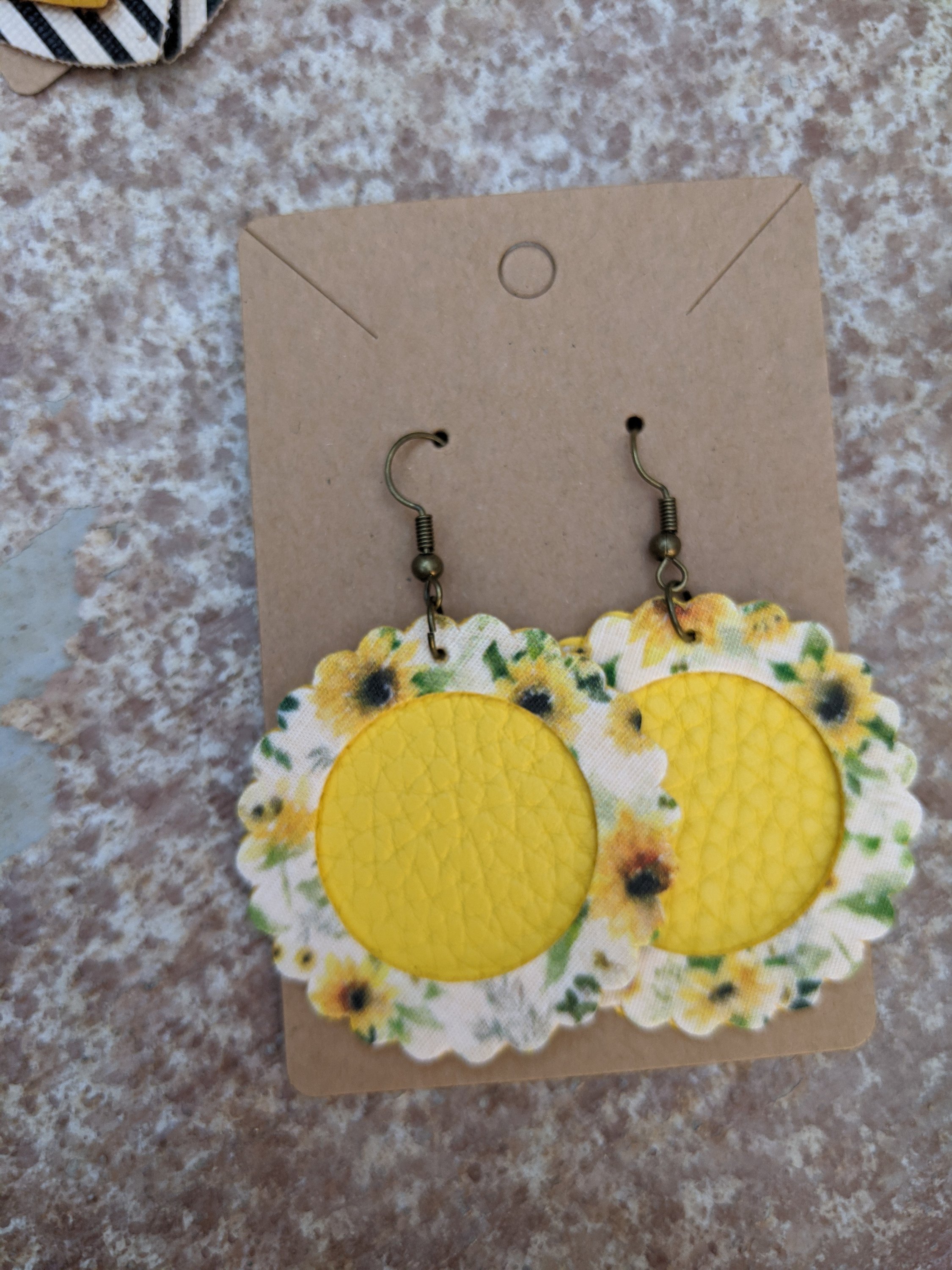 Handmade sunflower collection faux leather earrings, lightweight and hypoallergenic, measuring 1.5 inches in length.