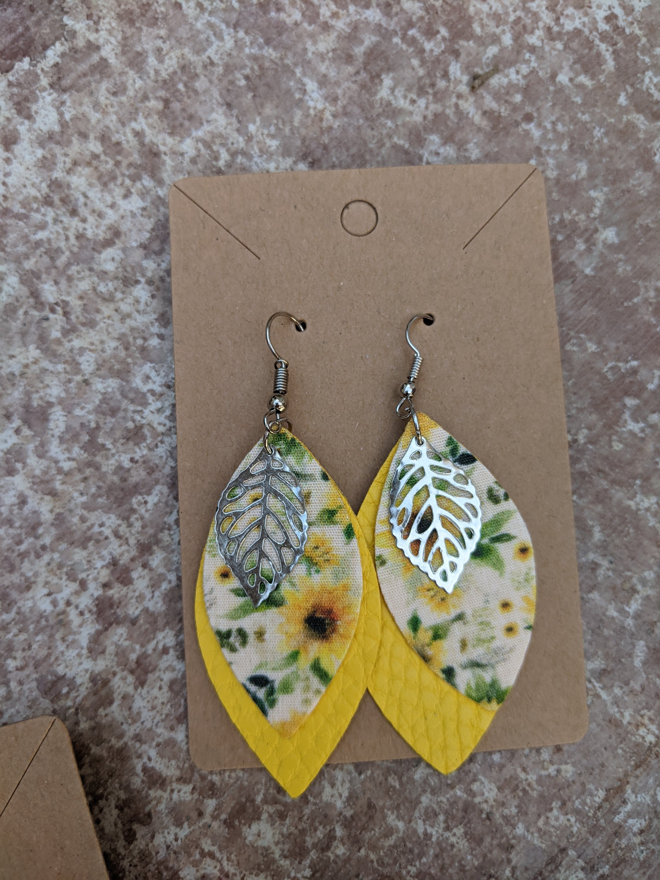 Handmade sunflower collection faux leather earrings, lightweight and hypoallergenic, measuring 1.5 inches in length.