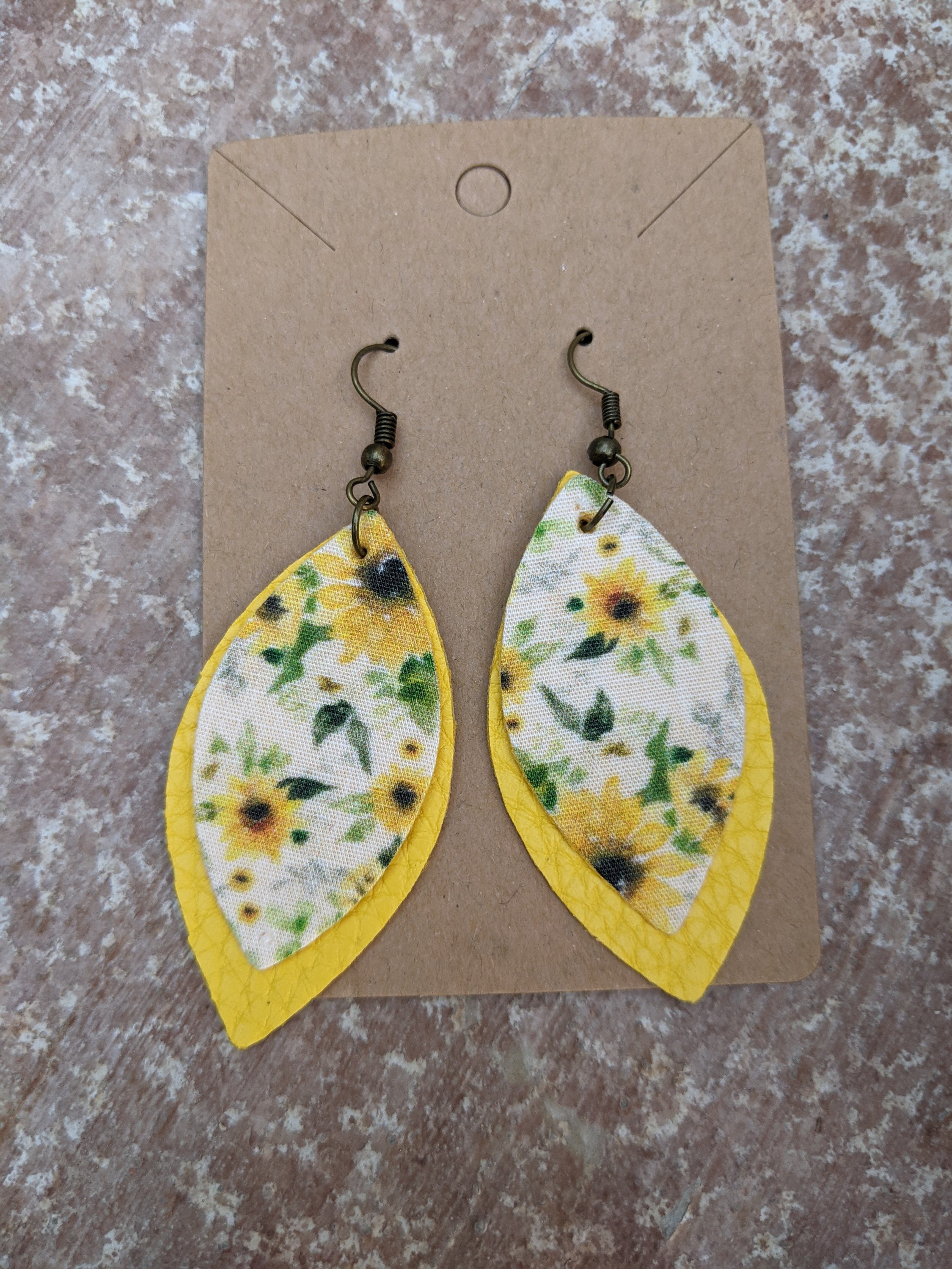 Handmade sunflower collection faux leather earrings, lightweight and hypoallergenic, measuring 1.5 inches in length.