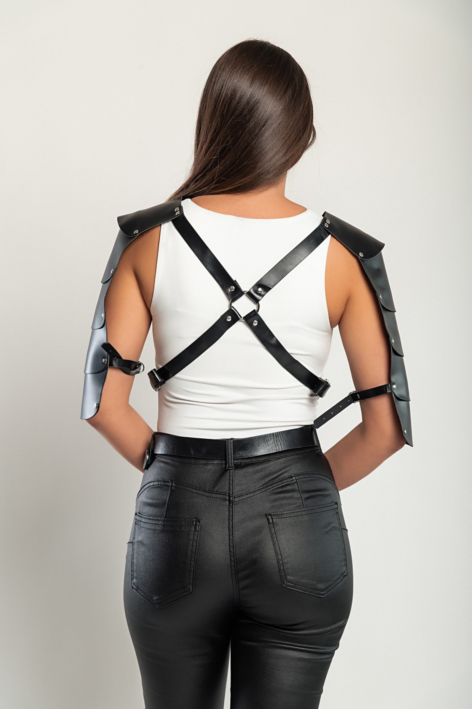 Black ART2783 harness belt made of faux leather with adjustable straps and sleeves, showcasing its stylish design and durable material.
