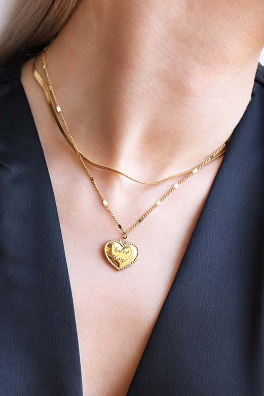 Elegant gold heart-shaped pendant necklace with 'I love you' inscription, perfect for expressing love.