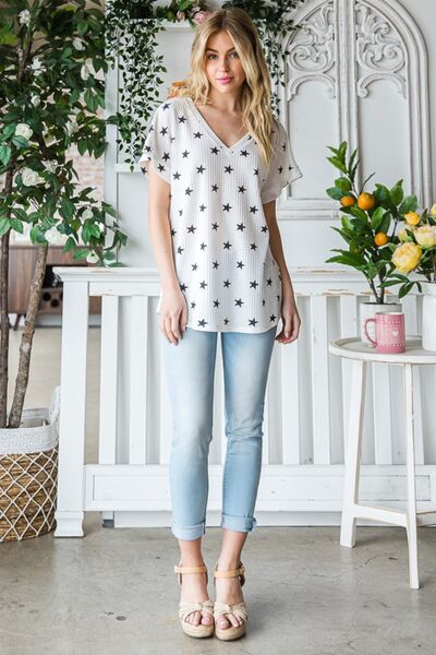 Heimish Full Size Star Print Short Sleeve V-Neck Waffle Knit T-Shirt featuring a playful star pattern and a flattering v-neckline.