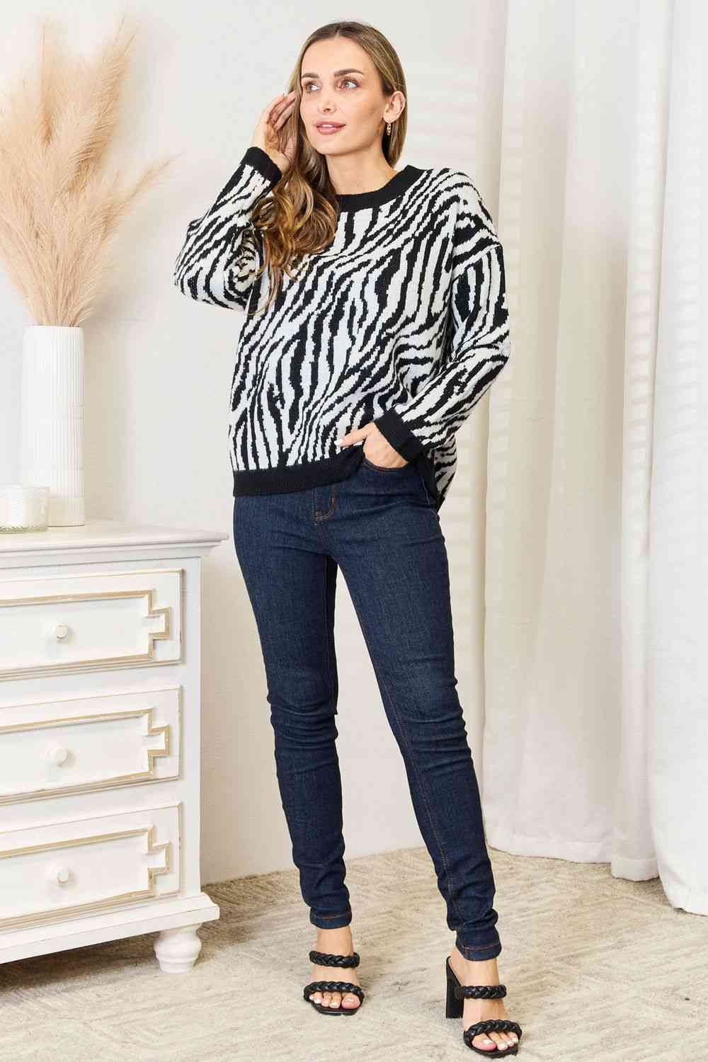 Heimsih Full Size Zebra Print Sweater featuring a classic round neck and long sleeves, showcasing a stylish zebra print design.