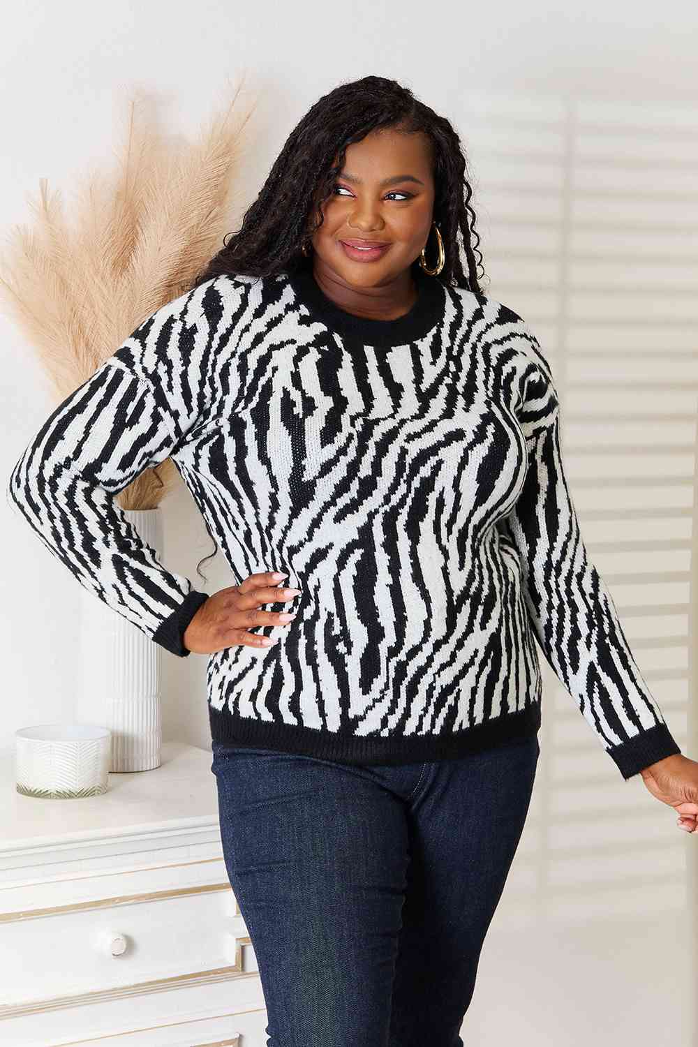 Heimsih Full Size Zebra Print Sweater featuring a classic round neck and long sleeves, showcasing a stylish zebra print design.