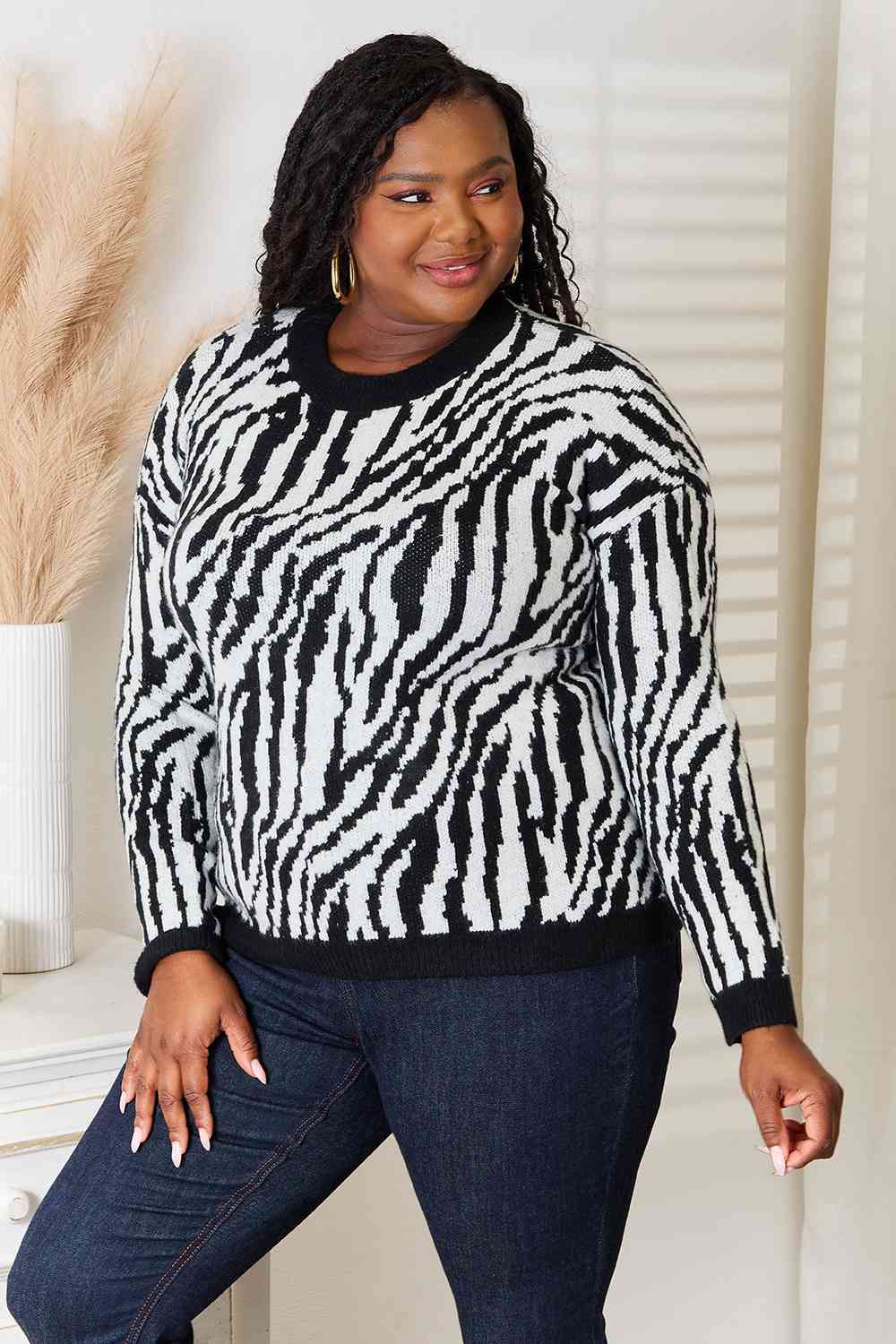 Heimsih Full Size Zebra Print Sweater featuring a classic round neck and long sleeves, showcasing a stylish zebra print design.