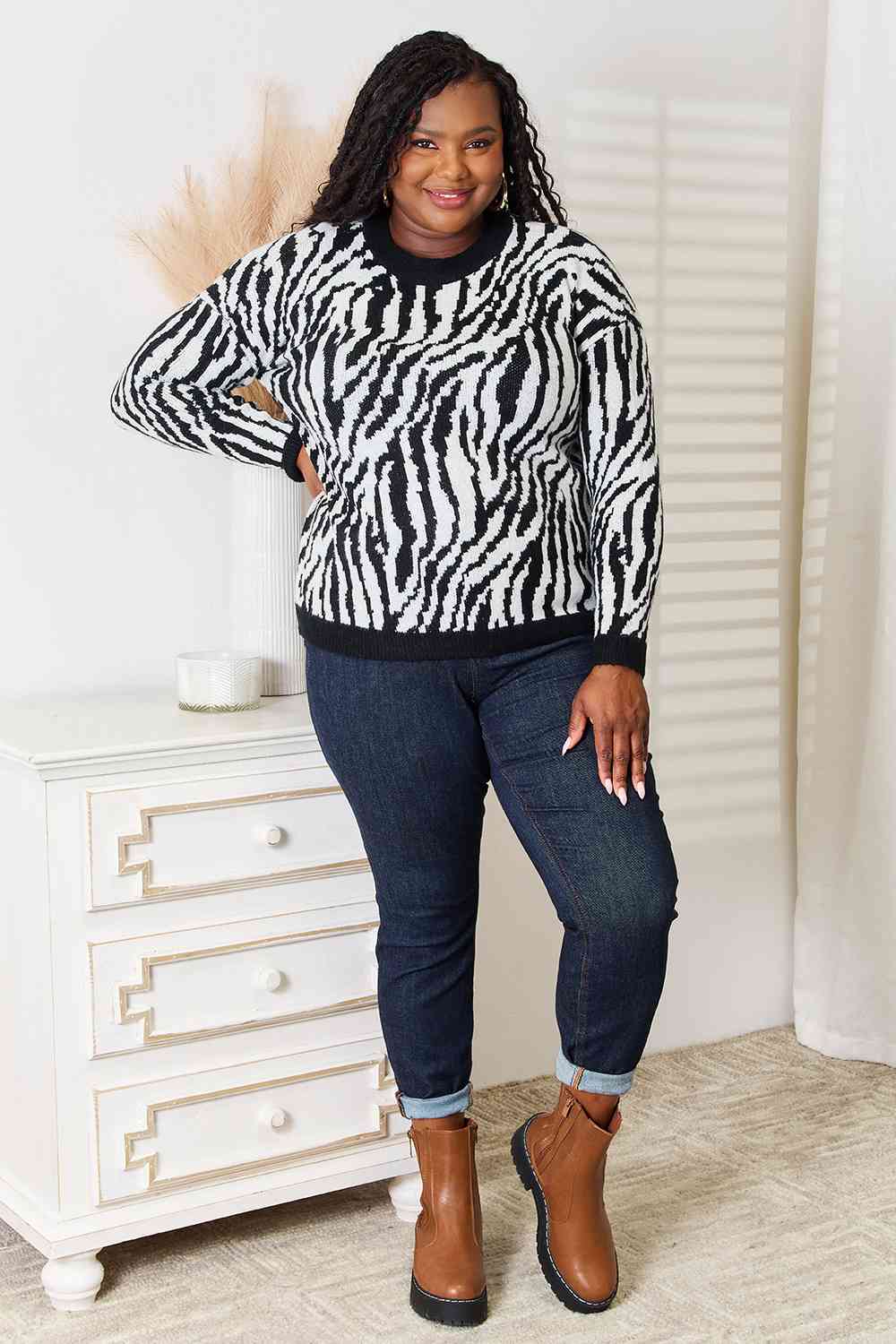 Heimsih Full Size Zebra Print Sweater featuring a classic round neck and long sleeves, showcasing a stylish zebra print design.