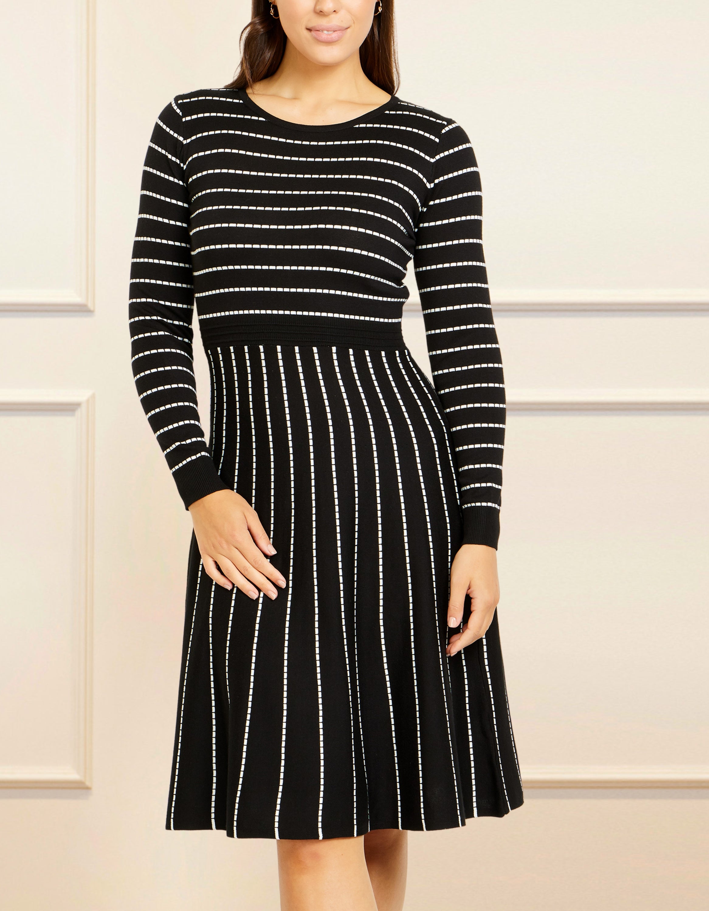 Henriette Dress in black and white stripes, featuring a round neckline and full-length sleeves, perfect for winter styling.