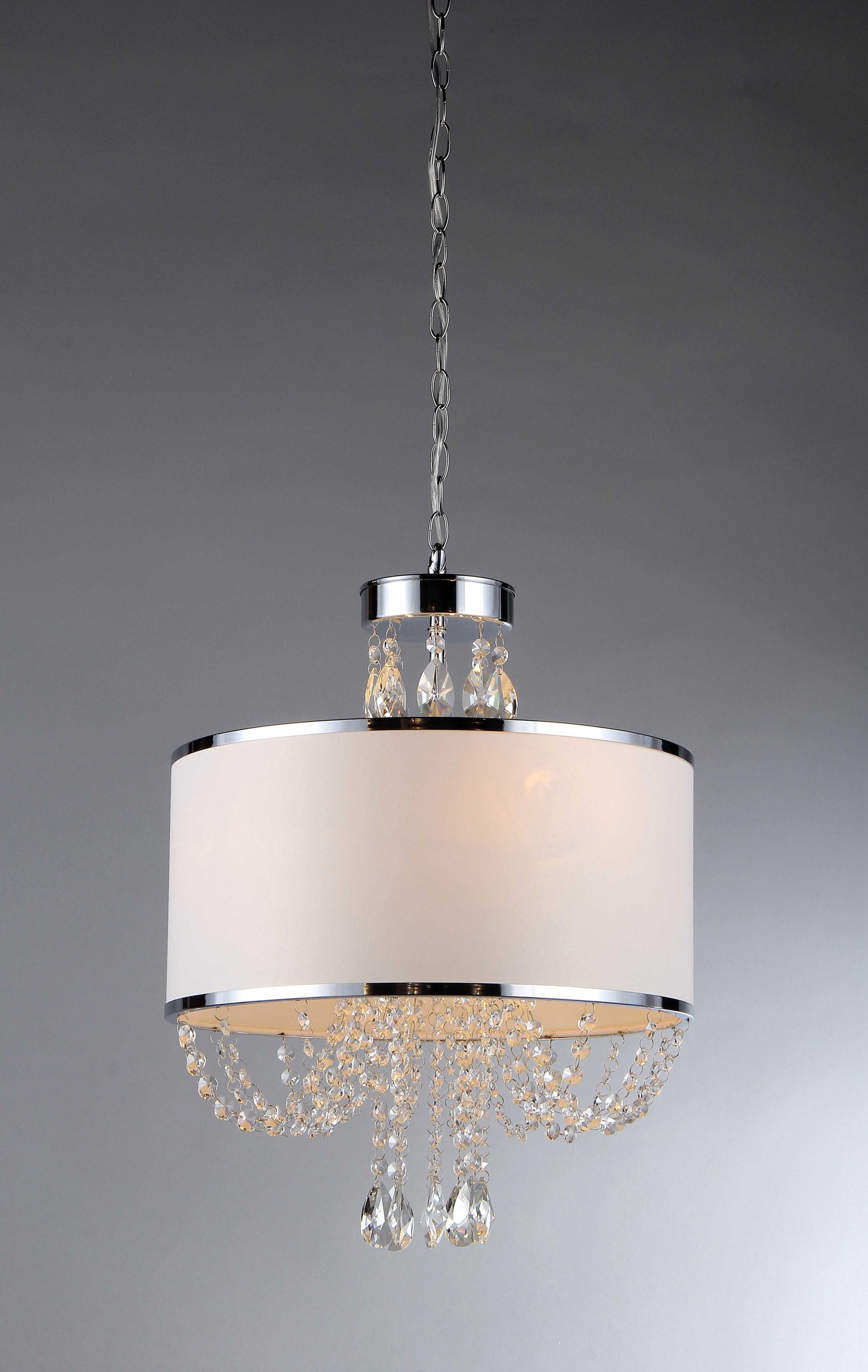 Elegant 'Hera' Shaded Crystal-detailed 4-light Chandelier with white fabric shade and metal edges, illuminating a stylish room.