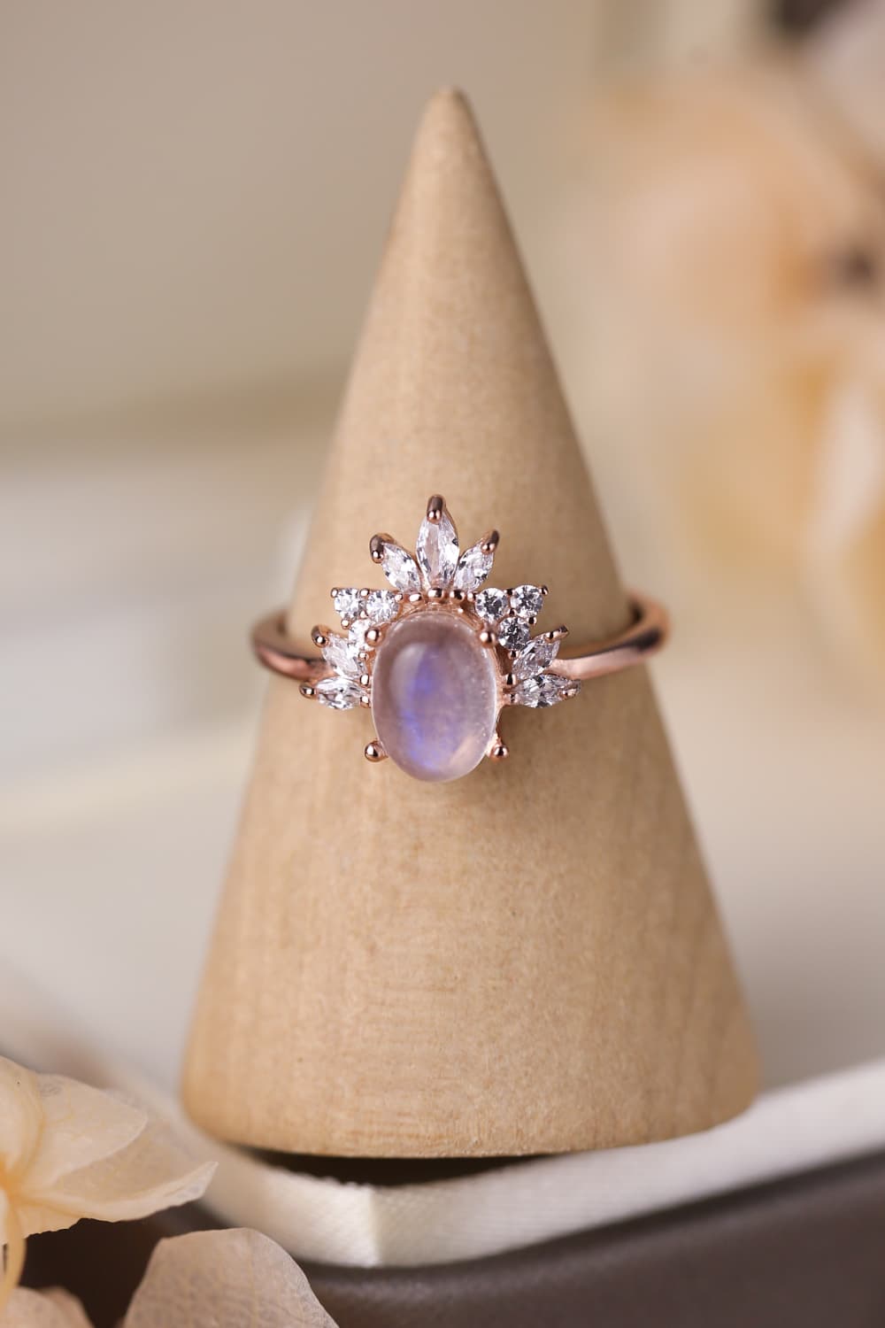High Quality Natural Moonstone ring in 18K rose gold-plated 925 sterling silver, showcasing its unique translucent white and blue-violet hues.