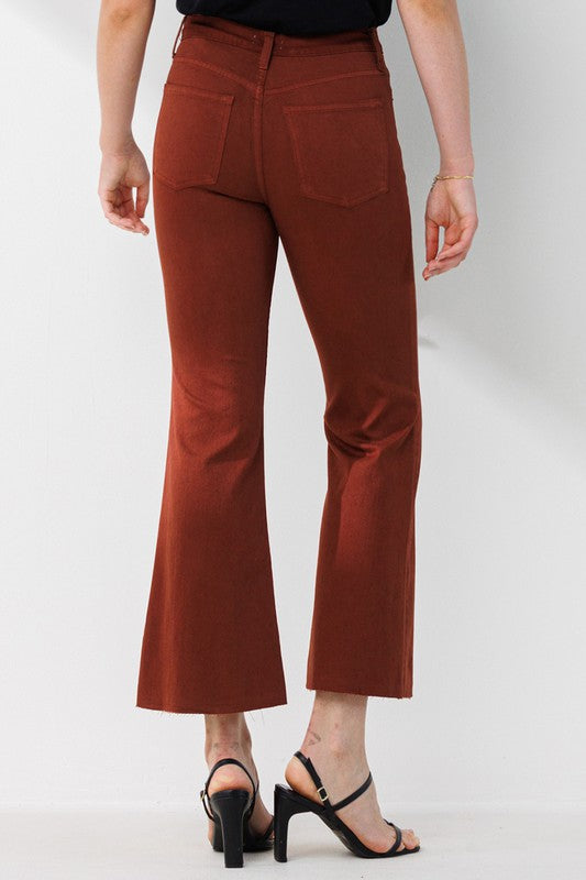High Rise Cropped Kick Flare pants with a raw cut hem, showcasing a stylish and modern design.